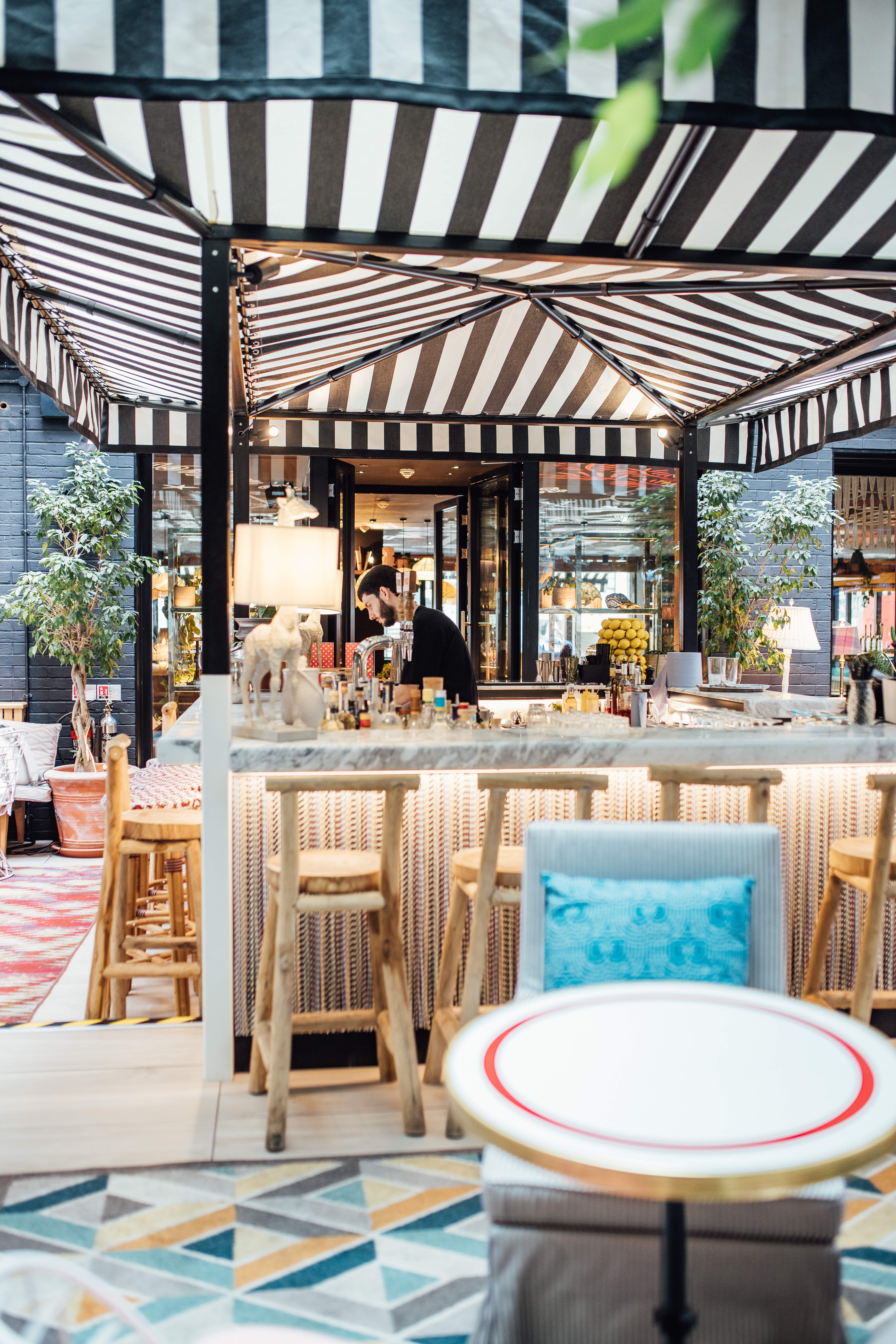 Stylish Garden Bar at Mama Shelter London with marble countertop, perfect for networking events.