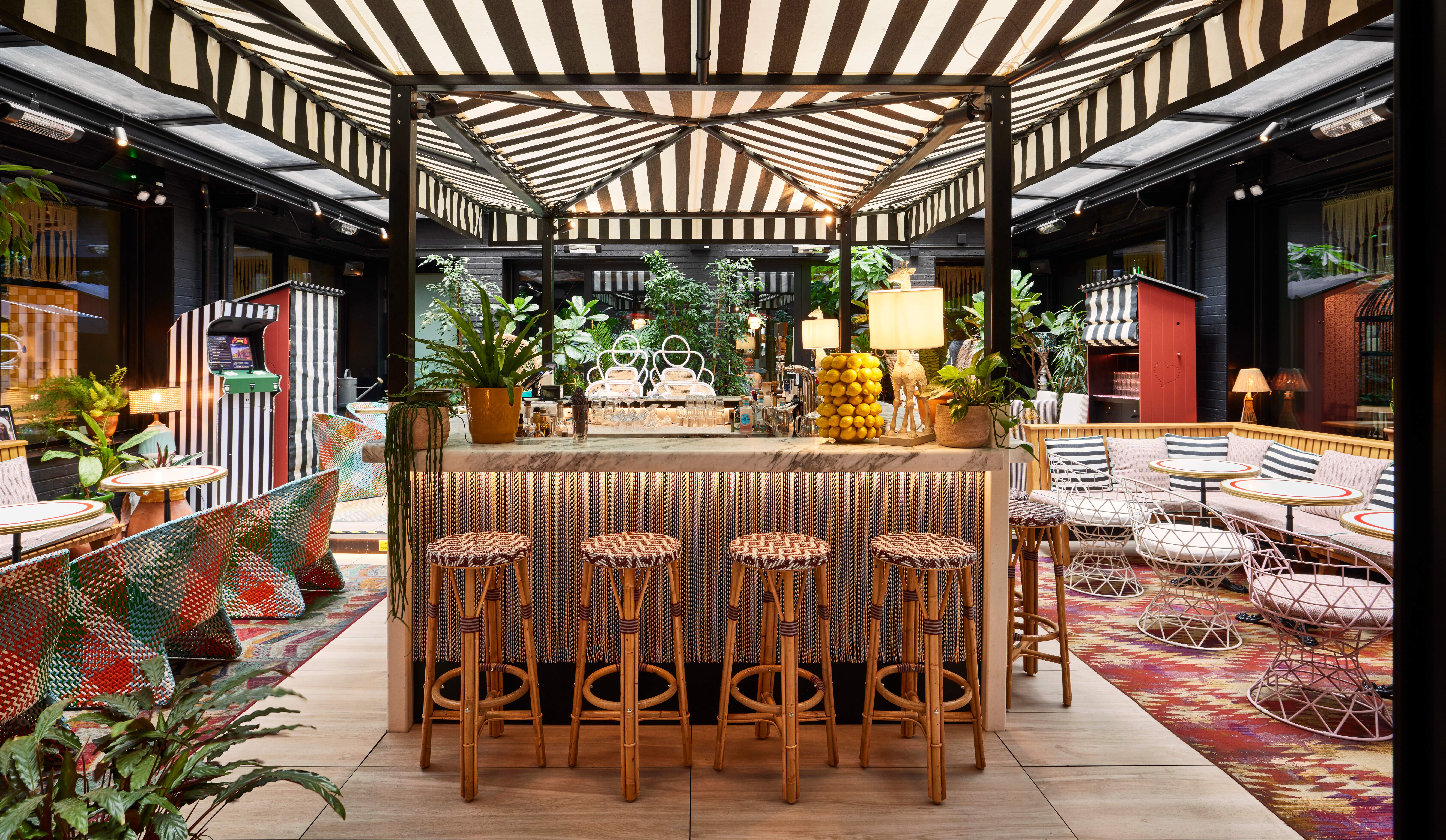 Vibrant Garden Bar at Mama Shelter London, ideal for events and gatherings.