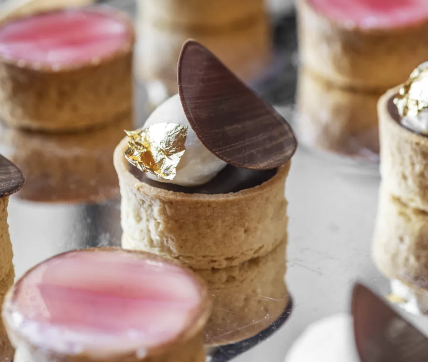 Elegant bite-sized catering with gold leaf for premium cocktail events and luxury receptions.