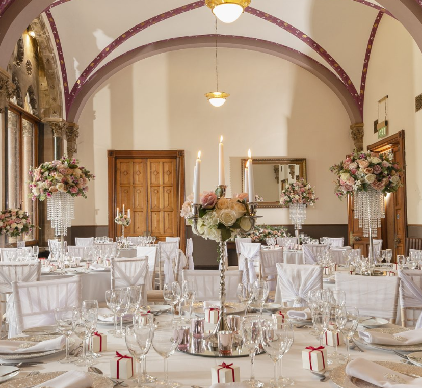 The Great Hall at Kelham Hall with gala floral centerpieces for weddings and black-tie events.