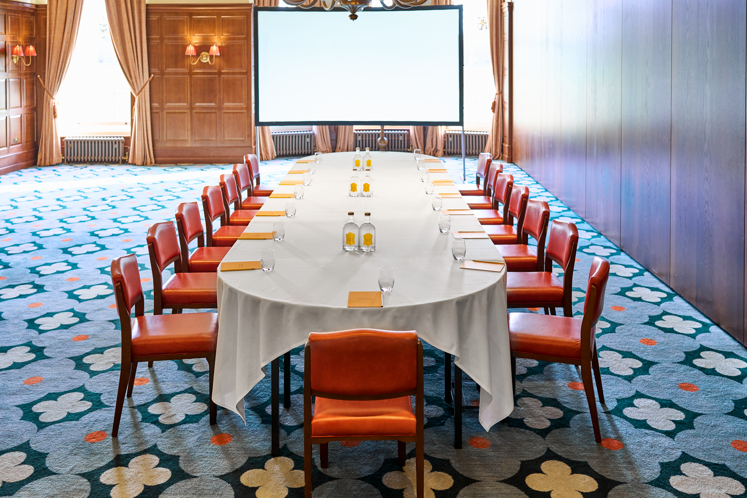 Meeting room at The Watson, University Arms Cambridge, set for roundtable discussions.