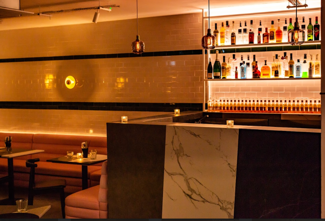 Modern bar at The Lounge & Kebab Queen, ideal for events and cocktail receptions.