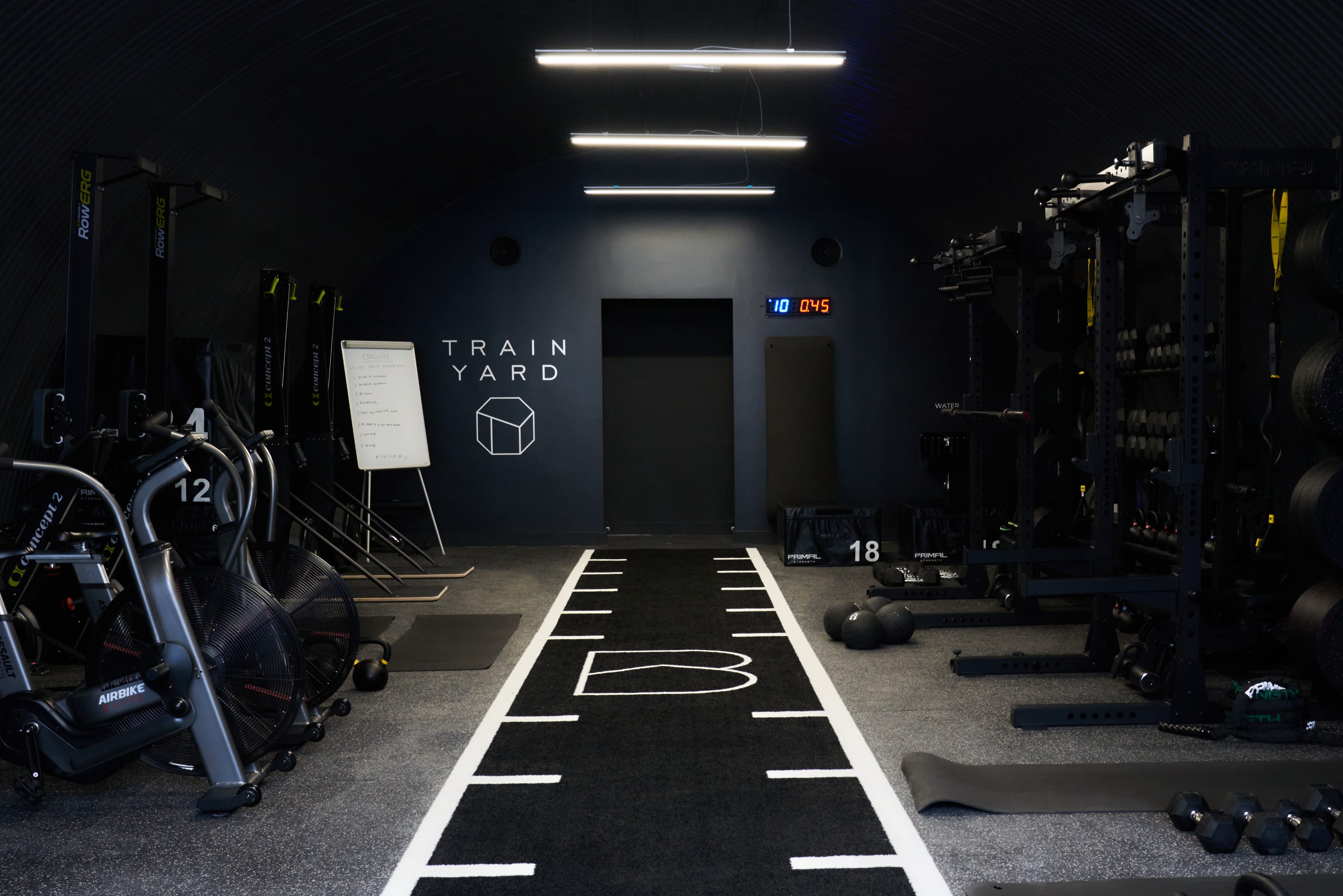 Hyrox fitness event at Train Yard London: industrial tunnel venue for corporate wellness retreats.