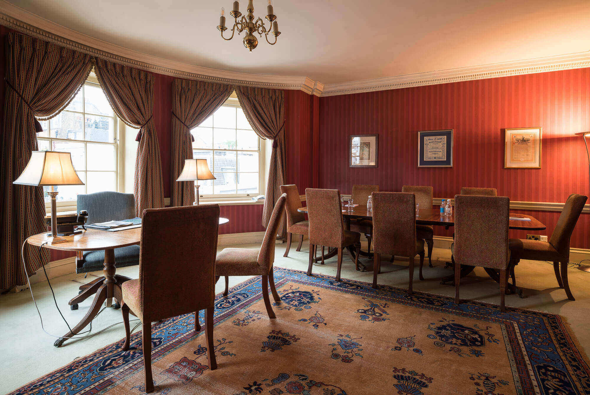 Historic boardroom at Pasley-Tyler & Co. for executive strategy sessions and corporate meetings.