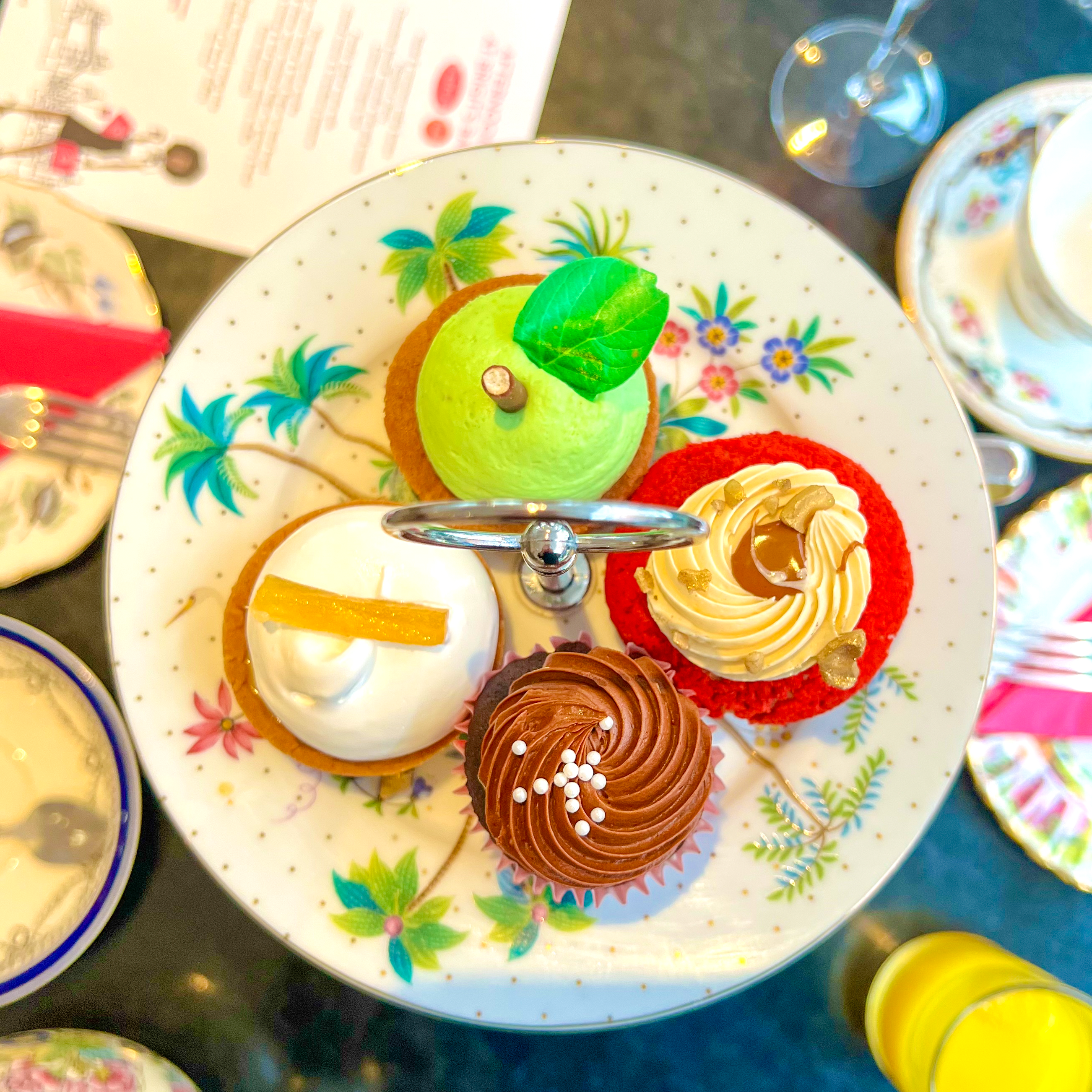 Brigit’s Bakery bus afternoon tea service with vintage floral china for VIP corporate events.