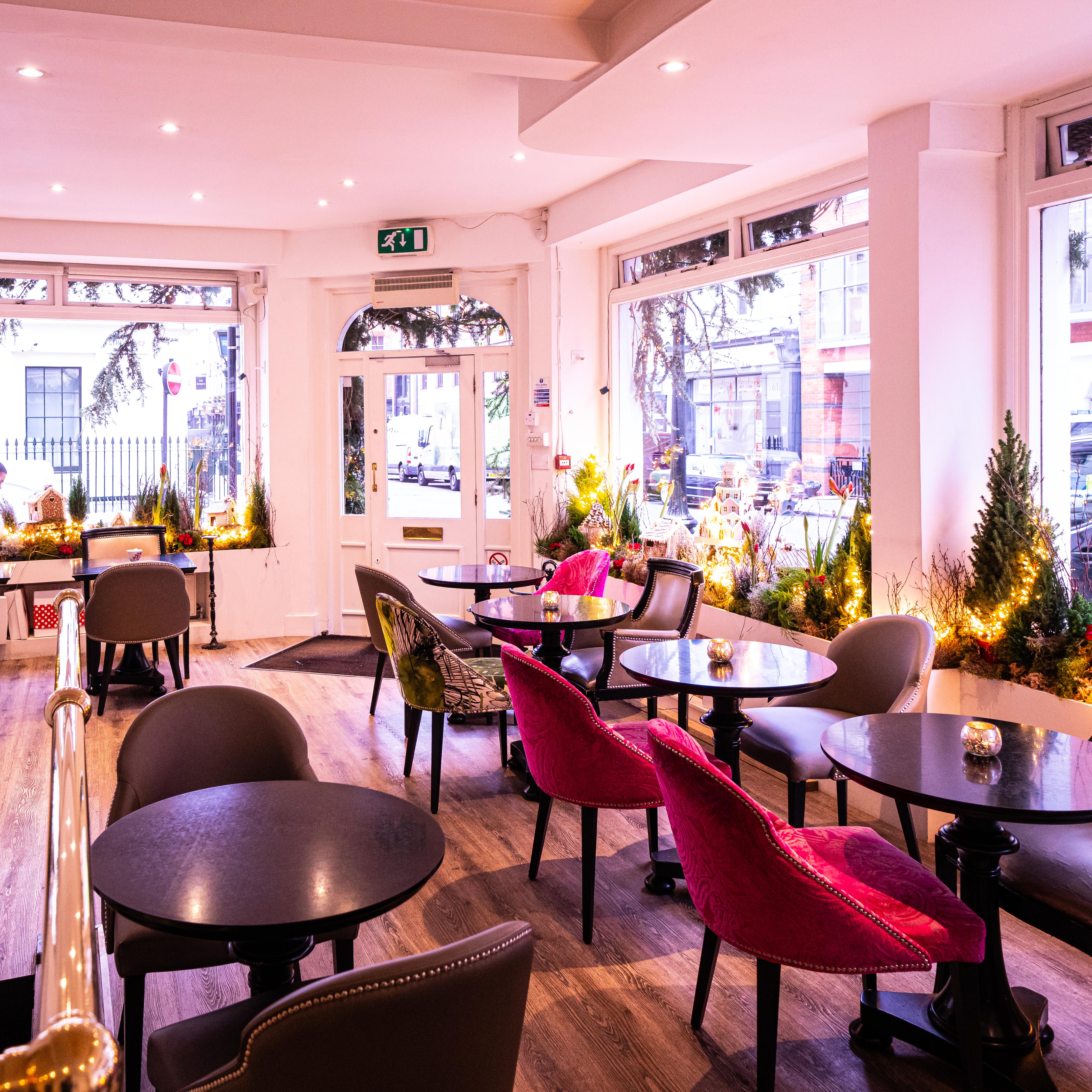 Brigit's Bakery London bus interior: plush seating for private corporate events and afternoon tea.