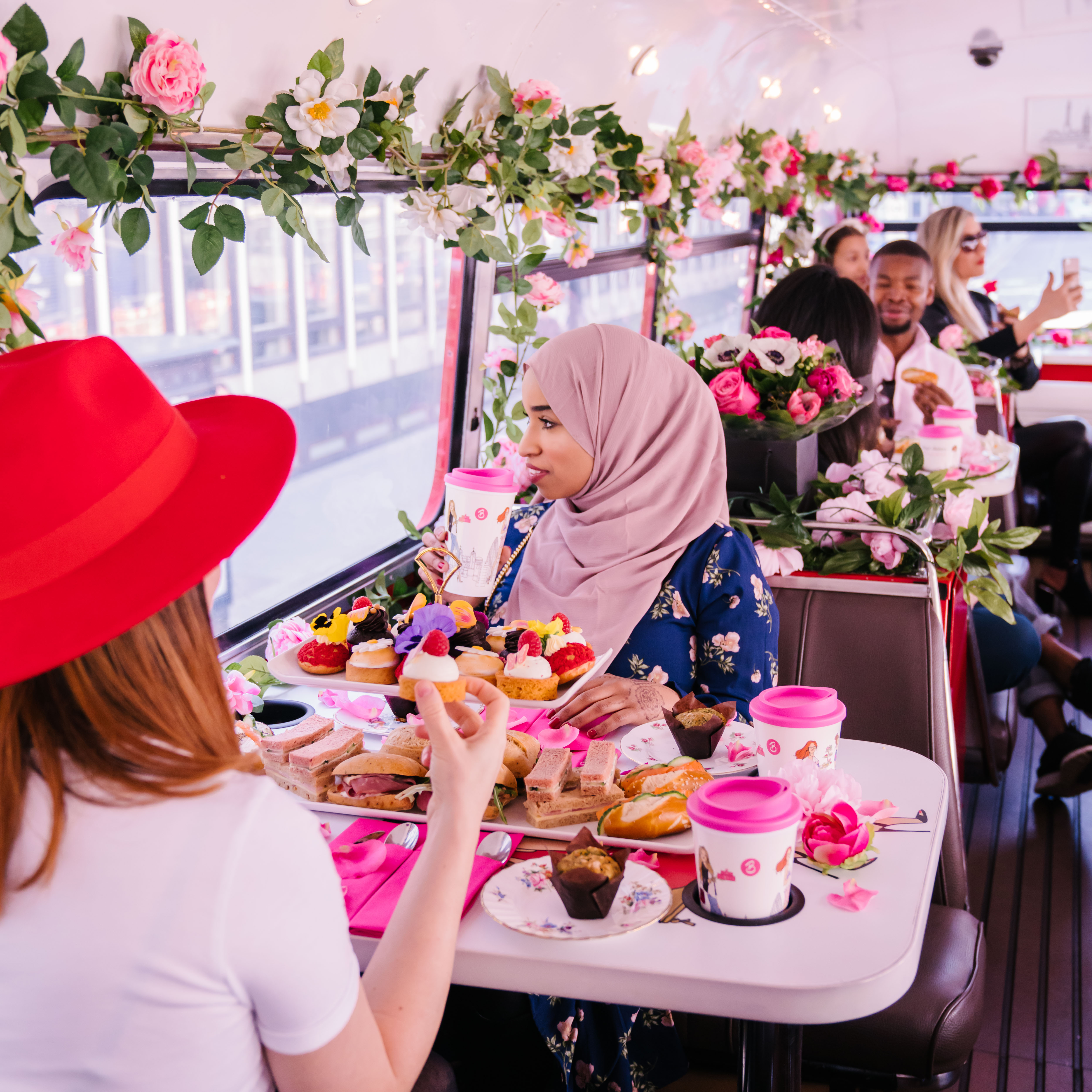 Floral-themed Brigit's Afternoon Tea Bus interior for luxury private events and mobile catering.