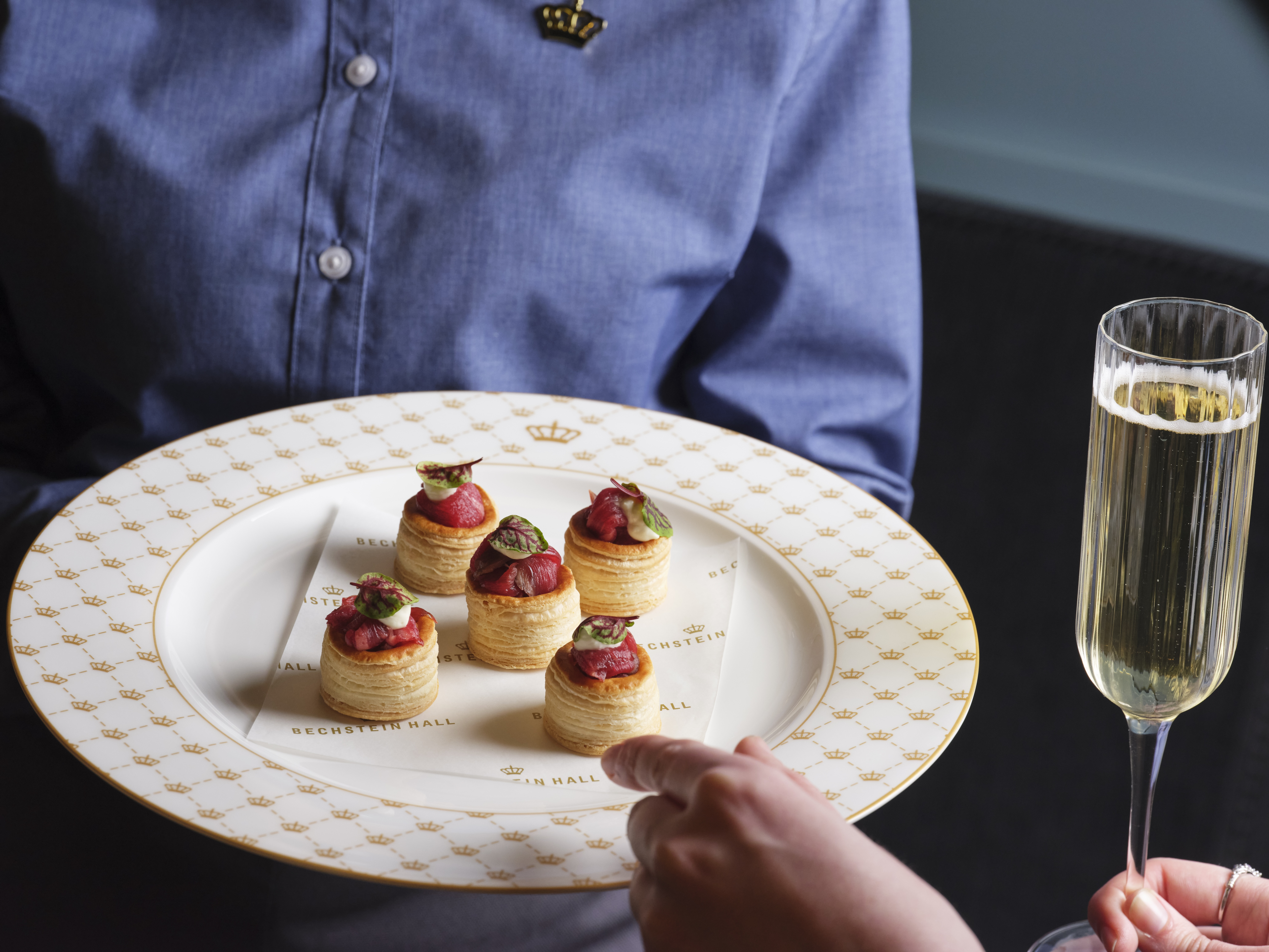 Elegant hors d'oeuvres on fine china at Bechstein Hall for upscale events.