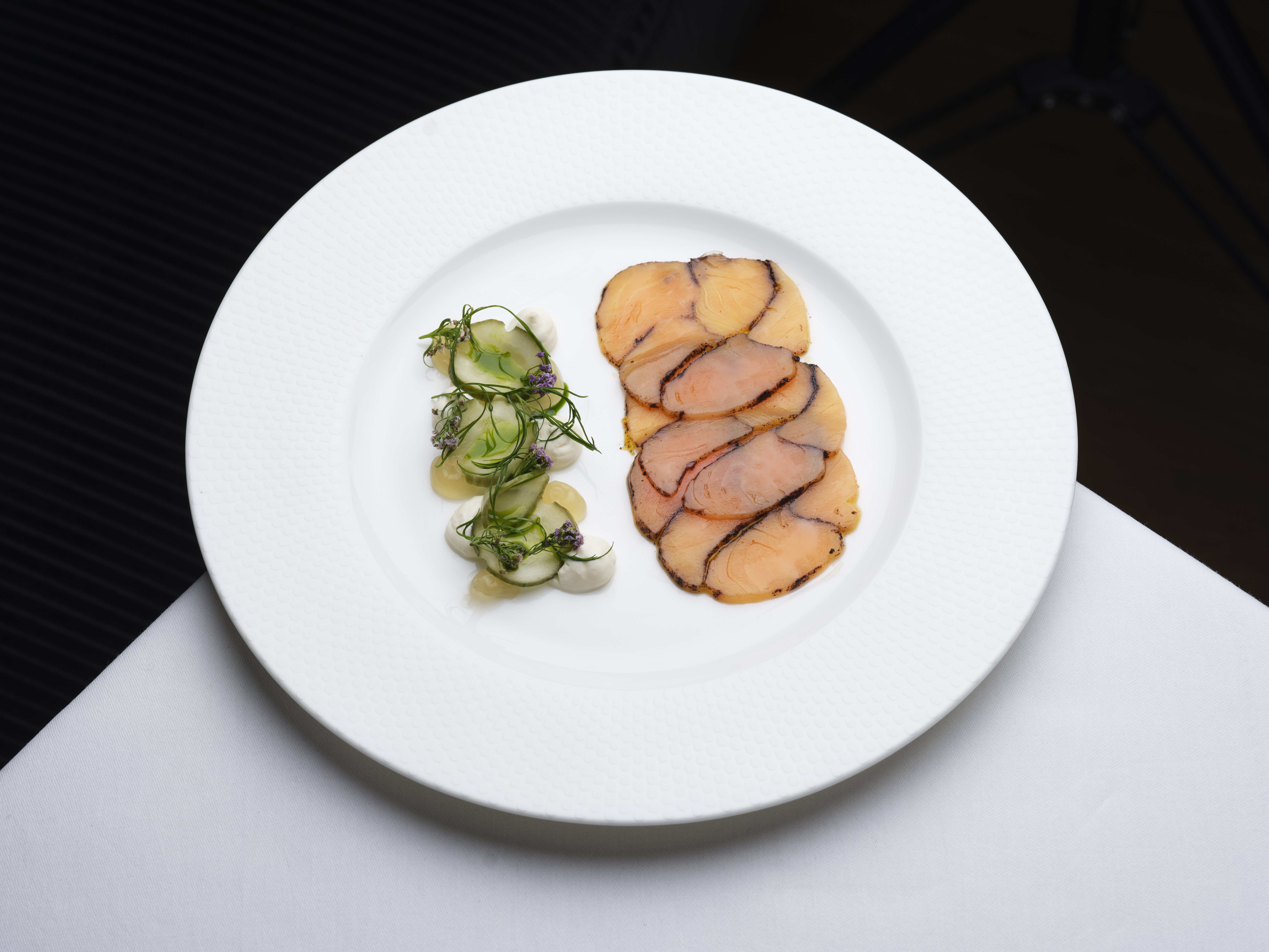 Elegant plated dish with protein and salad at Bechstein Hall for fine dining events.