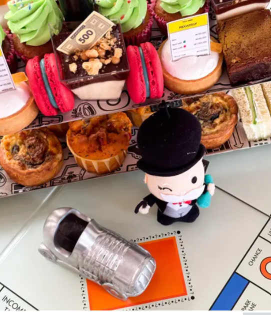Monopoly-themed afternoon tea on a London bus for corporate events and experiential catering.