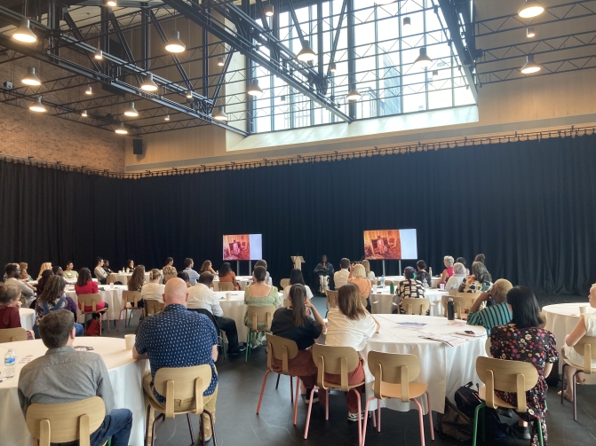 Martha Graham Studio event space with round tables for networking and presentations.