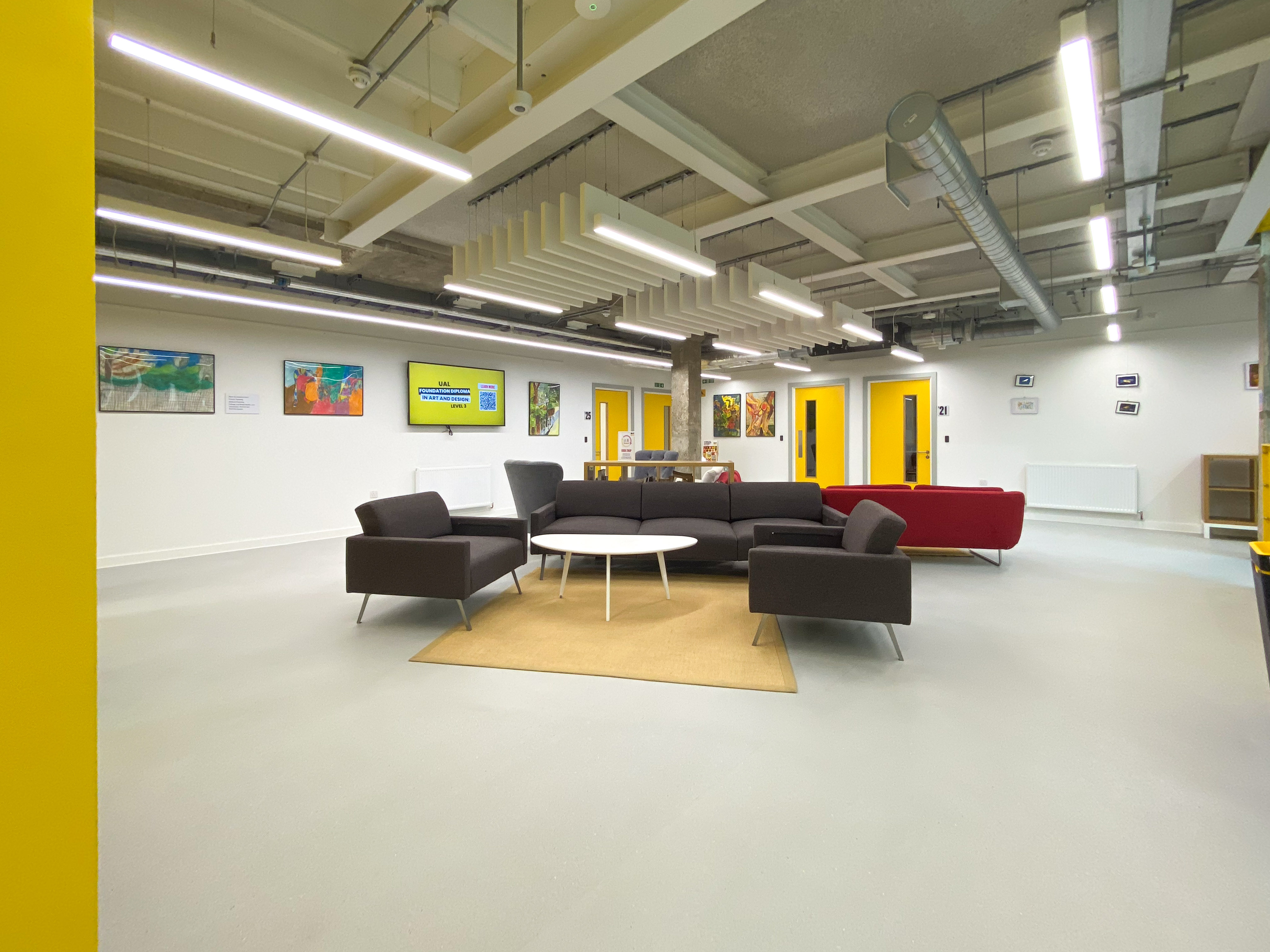 Modern classroom at Mary Ward Centre with vibrant decor for creative meetings.