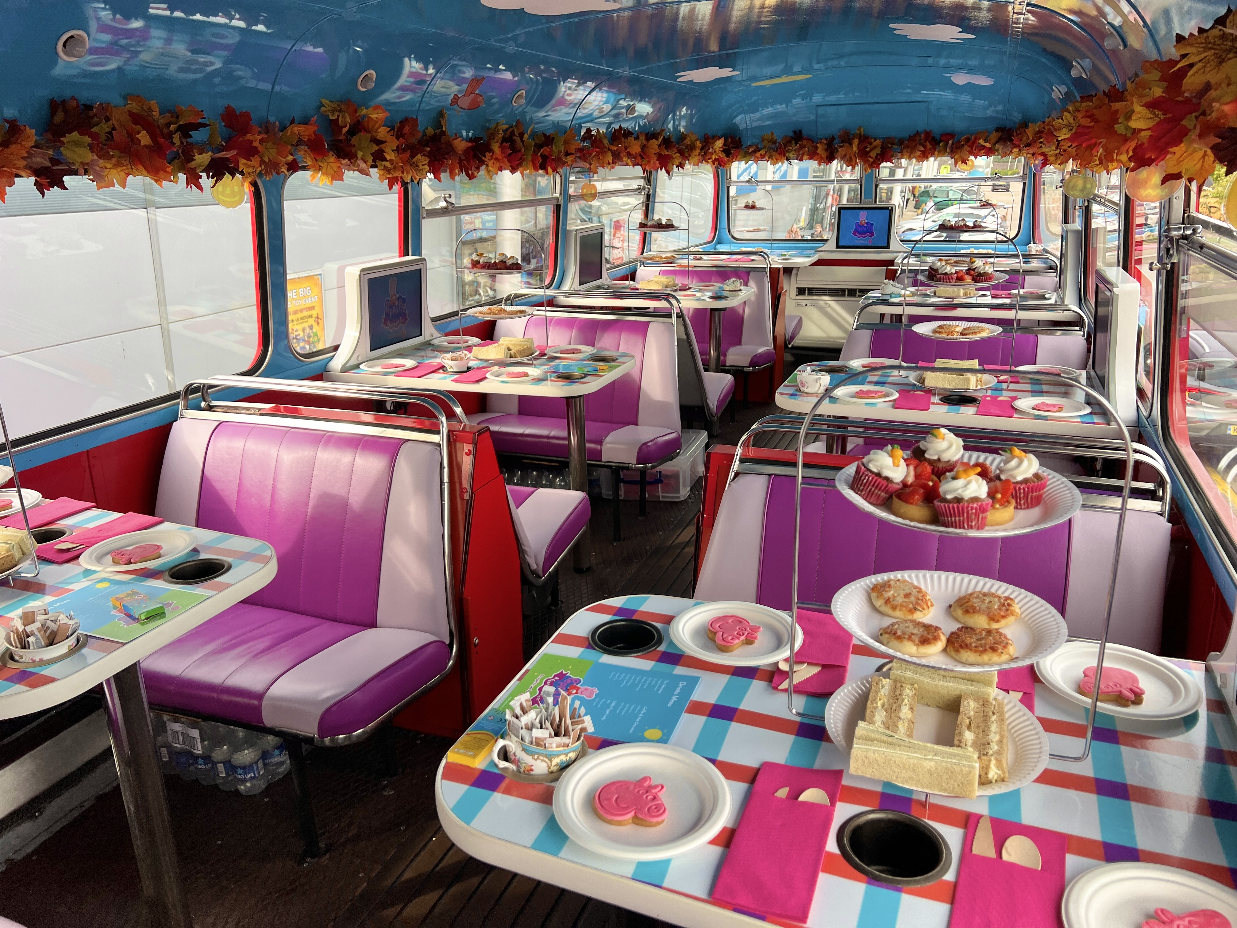 Peppa Pig-themed afternoon tea bus hire in London for branded experiential party events.
