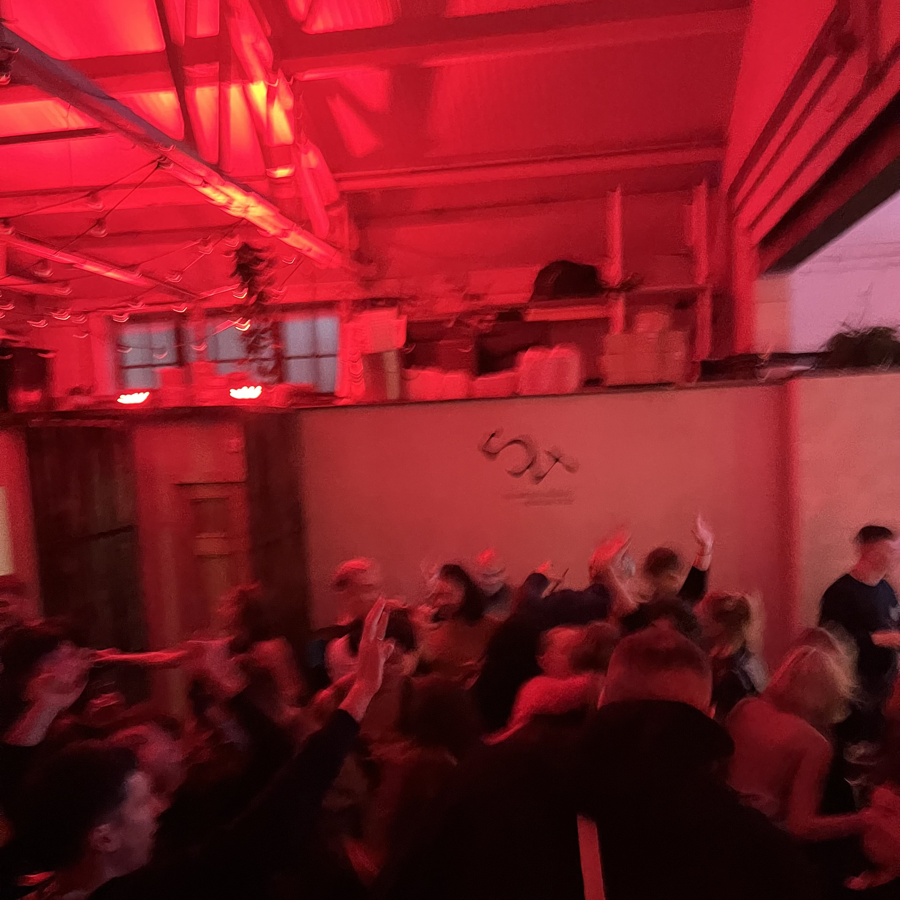 Brand activation at The New Cross with immersive red lighting for experiential corporate events.