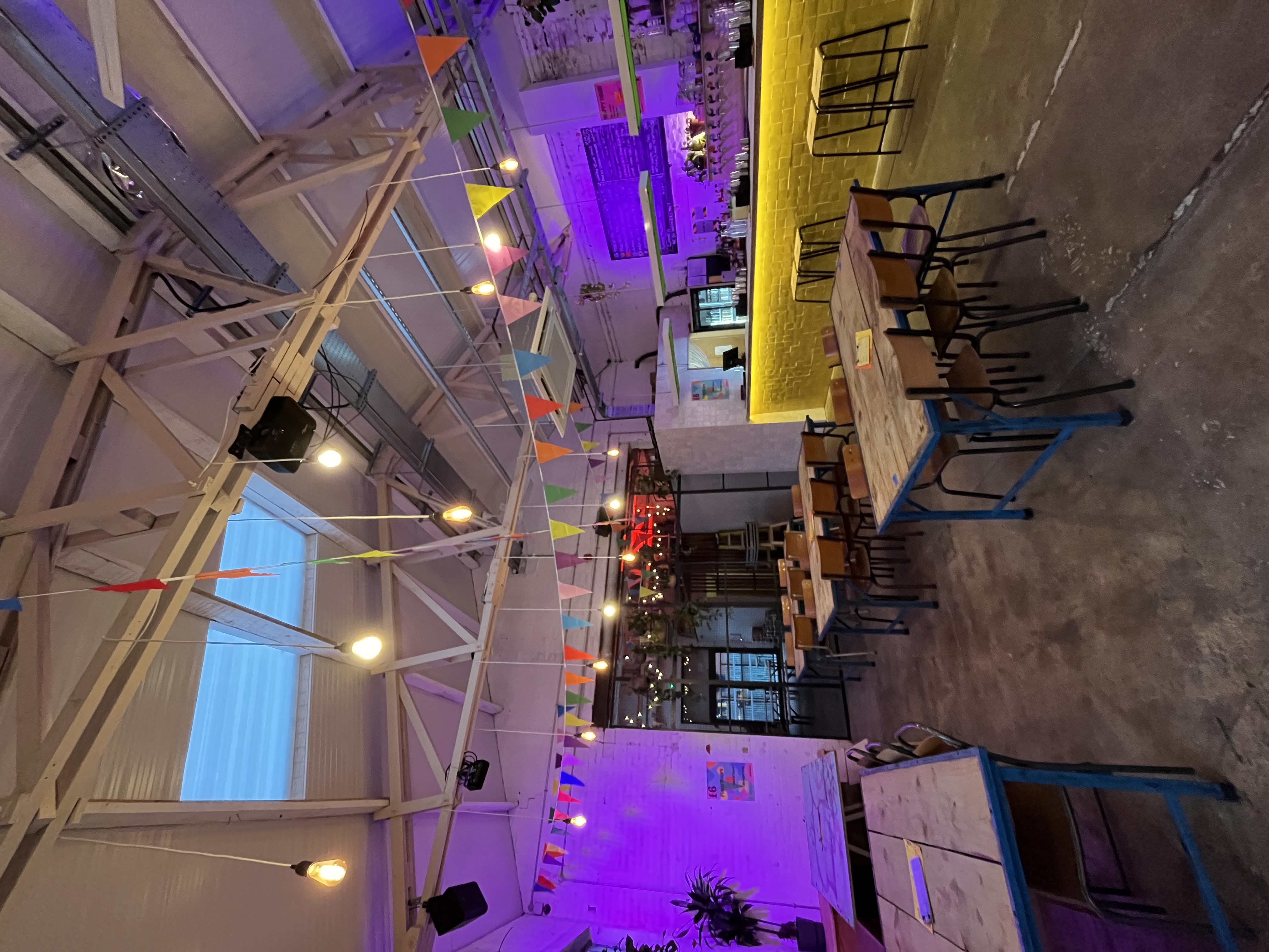 Industrial-chic event space with raw architecture for networking and team building.