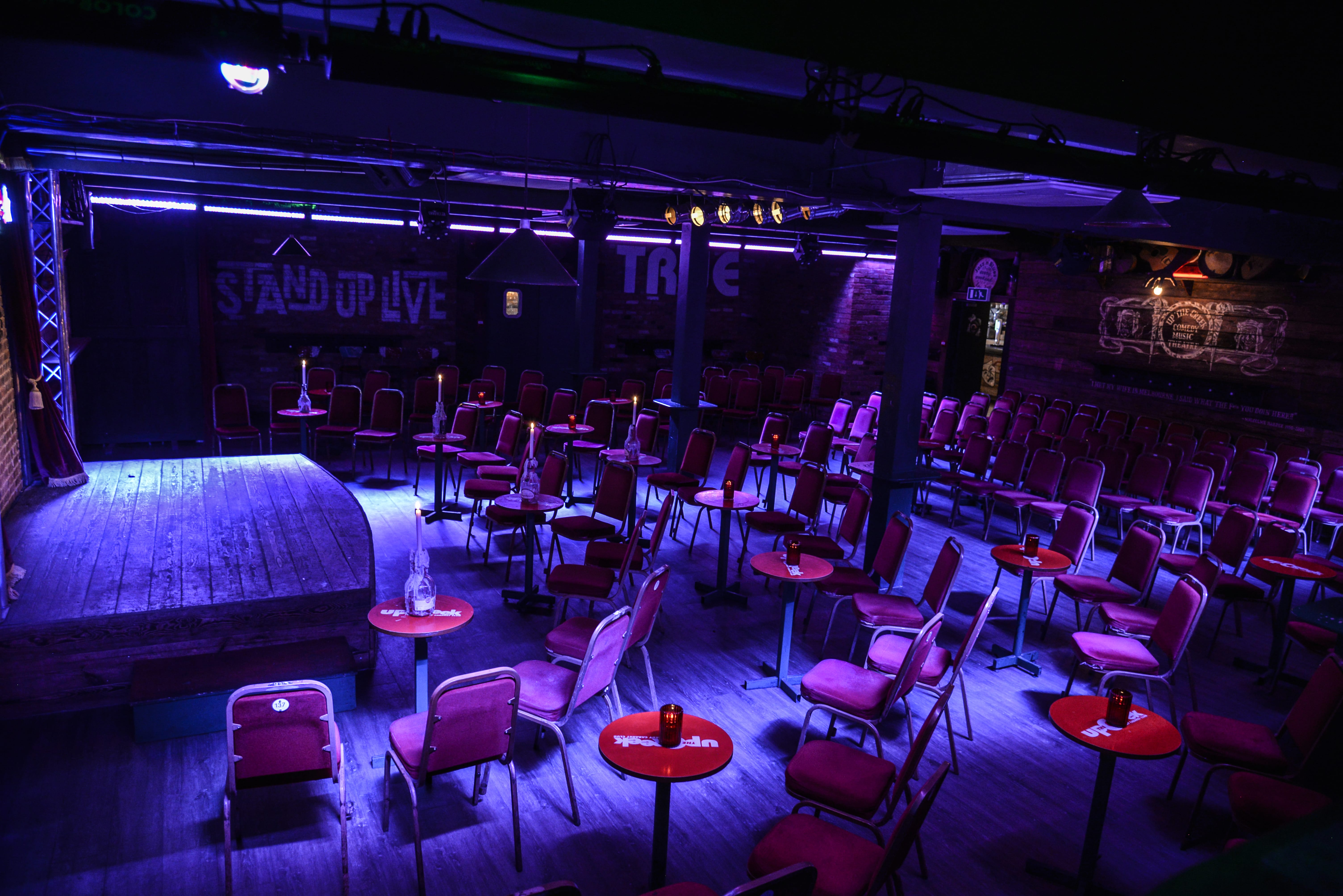 Versatile event space with raised stage, perfect for comedy nights and small concerts.