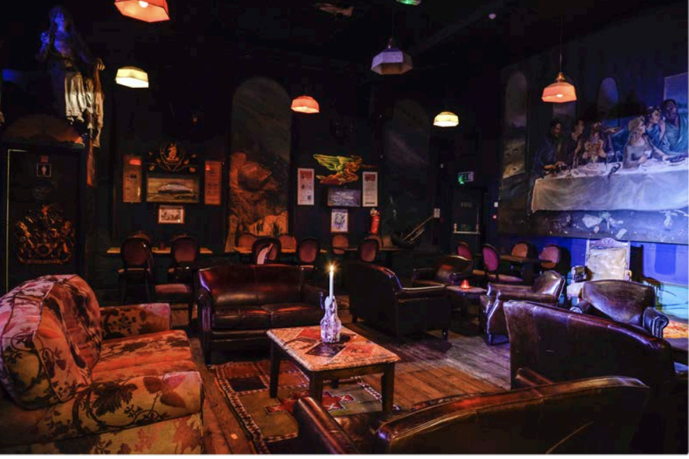 Intimate event space with plush seating for cozy gatherings in Up The Creek.