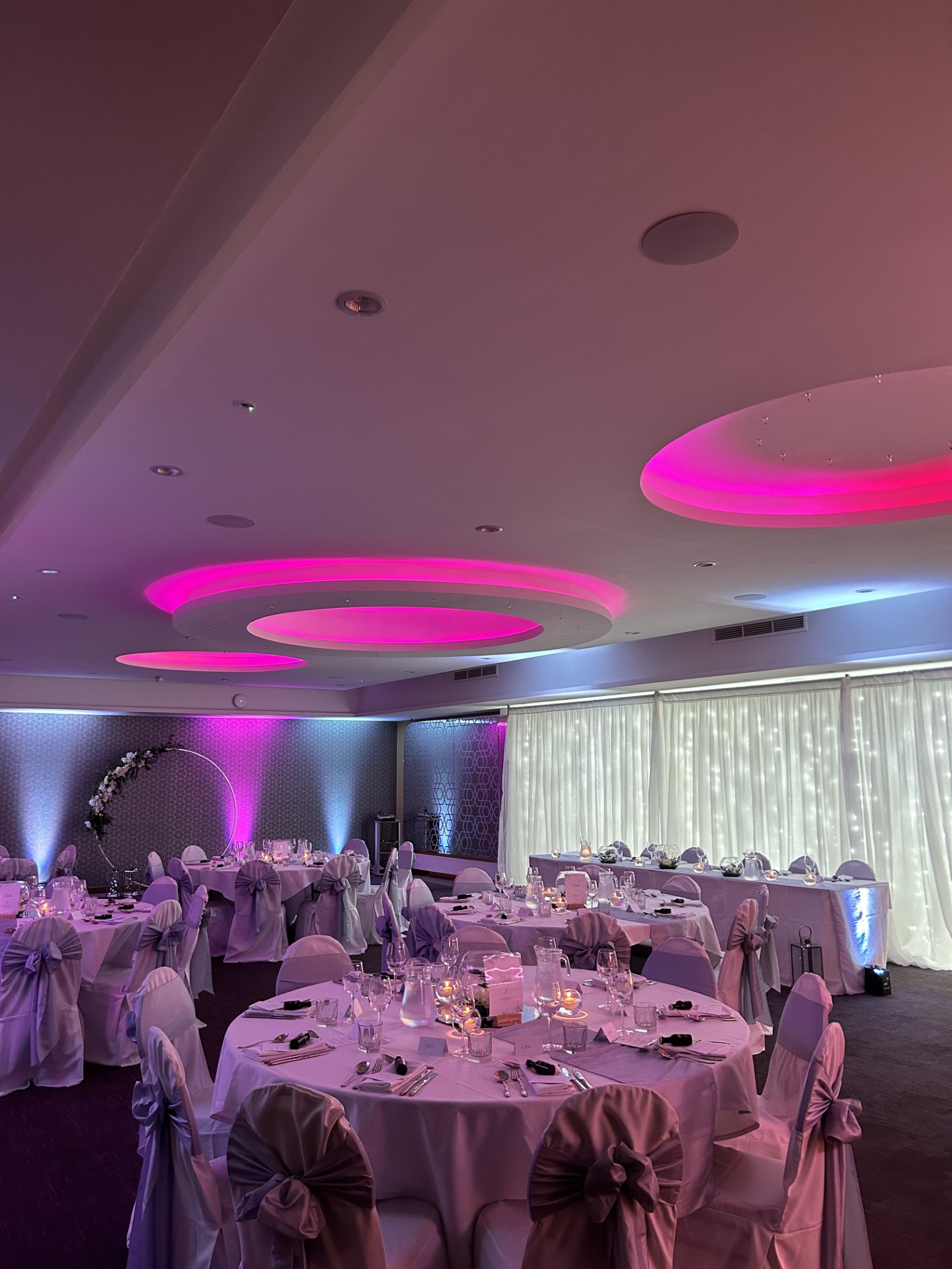 Elegant wedding venue with pink accents and soft lighting at The York, The Place Hotel.
