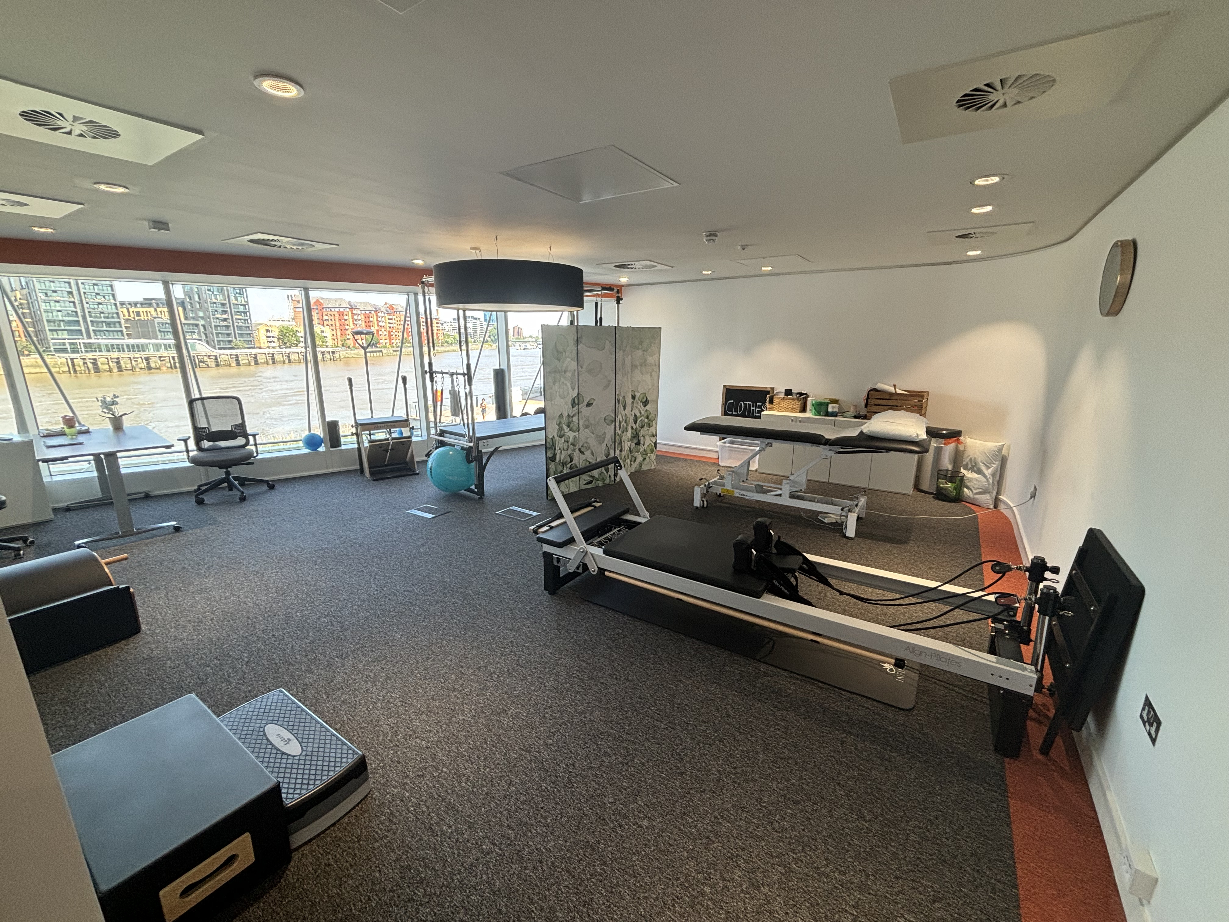 Elite Physios wellness suite with waterfront views for mindfulness sessions and VIP retreats.