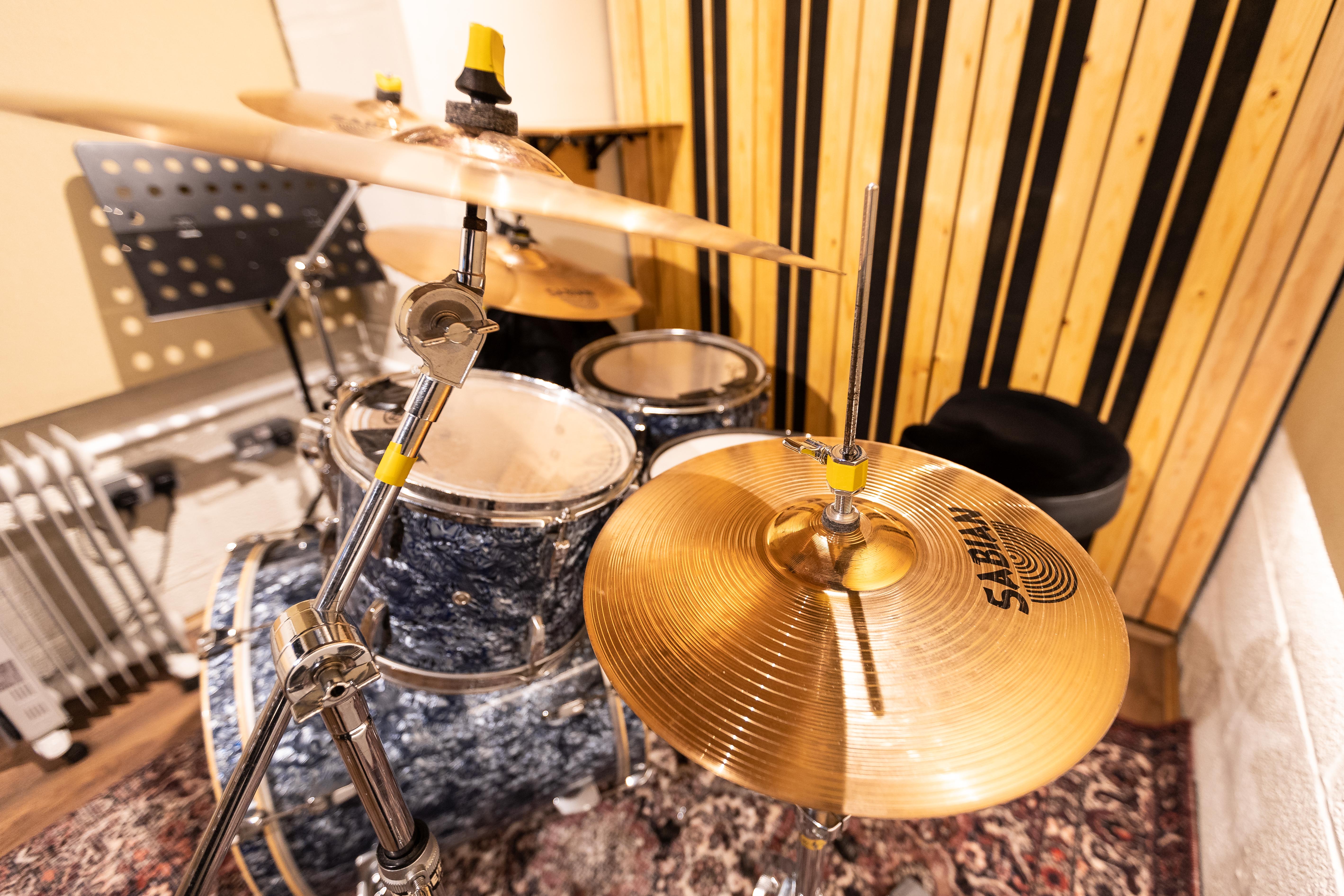 AV-ready stage at Yellow Hat Studios with acoustic walls for live music and studio recording.