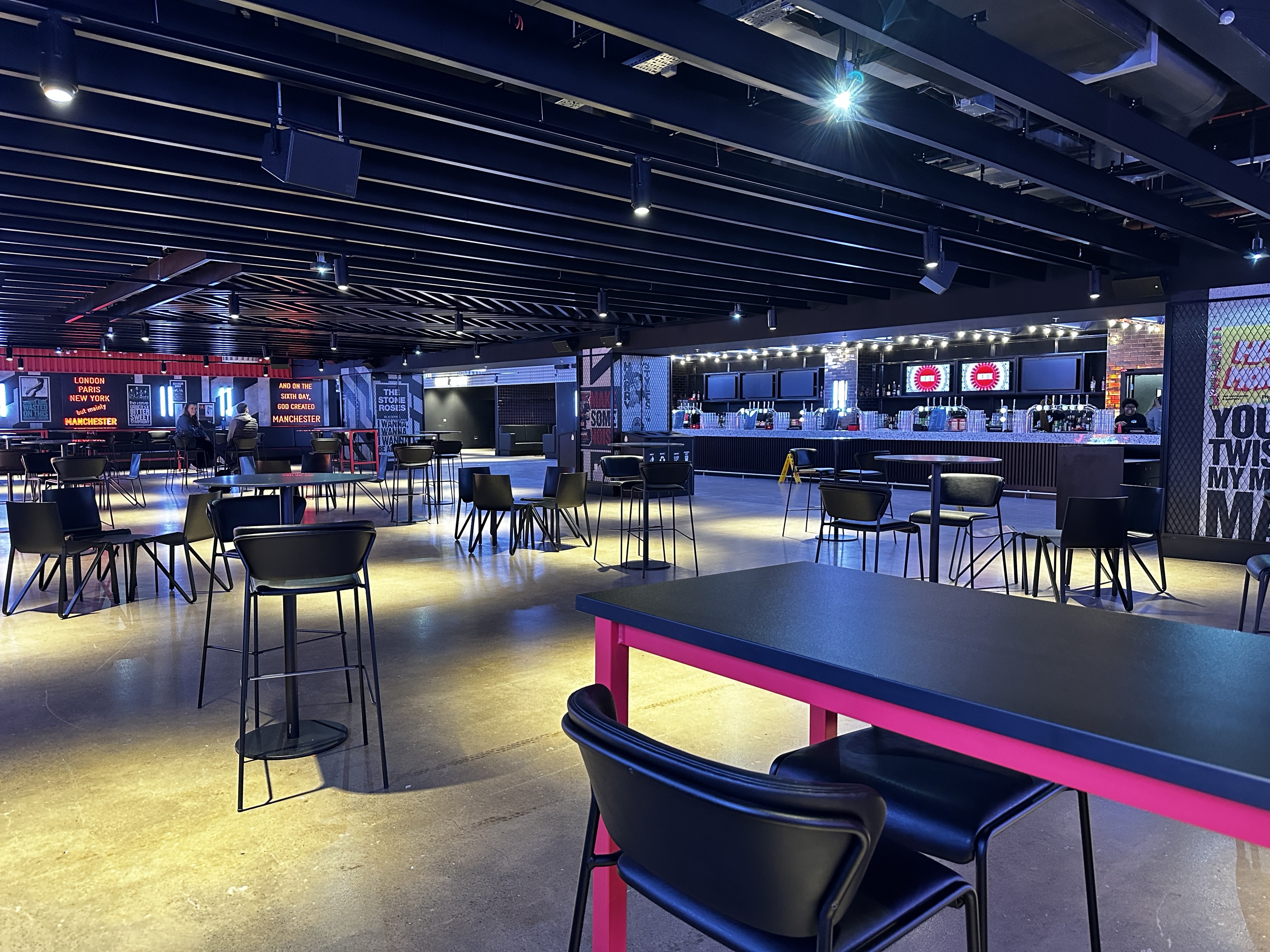 Co-op Backstage: Modern event space with flexible seating for networking and presentations.