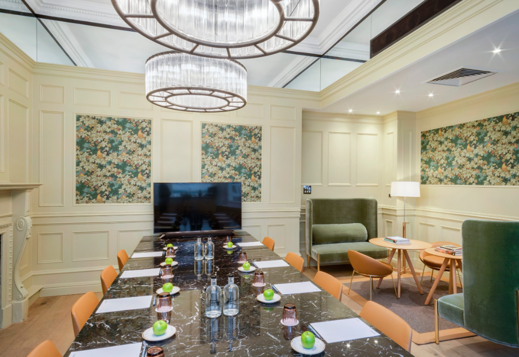 Oak Room boutique boardroom with marble table for executive meetings and corporate strategy sessions.