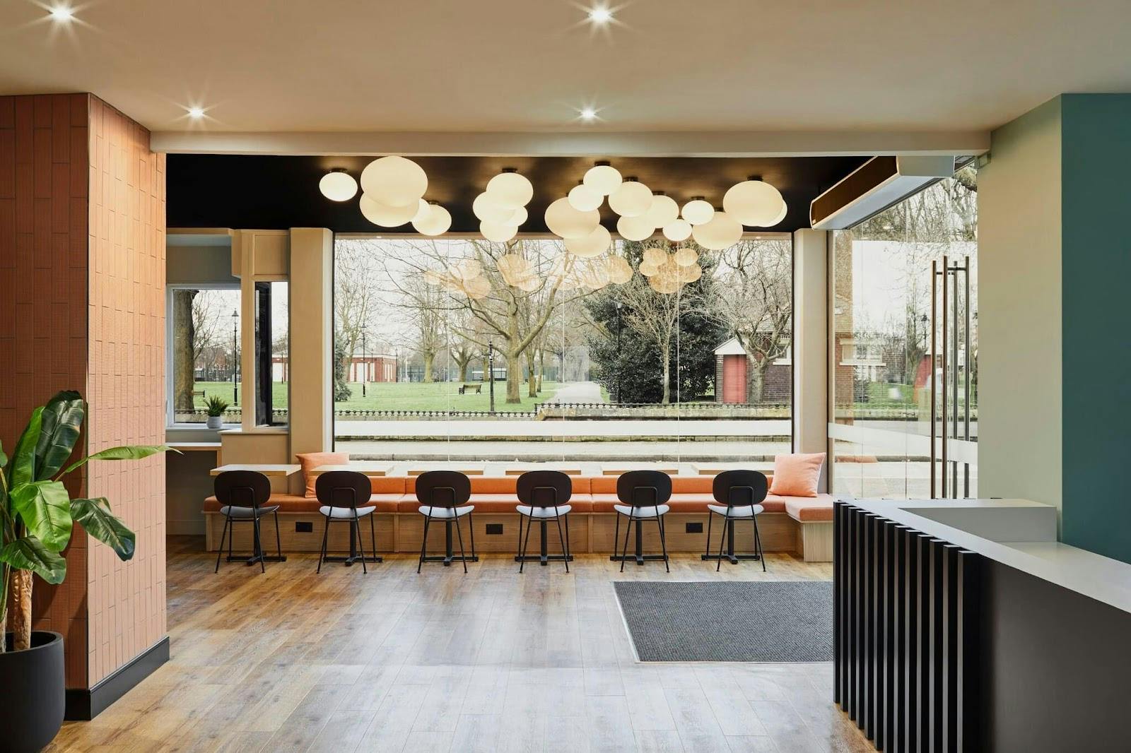 Modern breakout meeting room with bench seating for conferences and networking events.