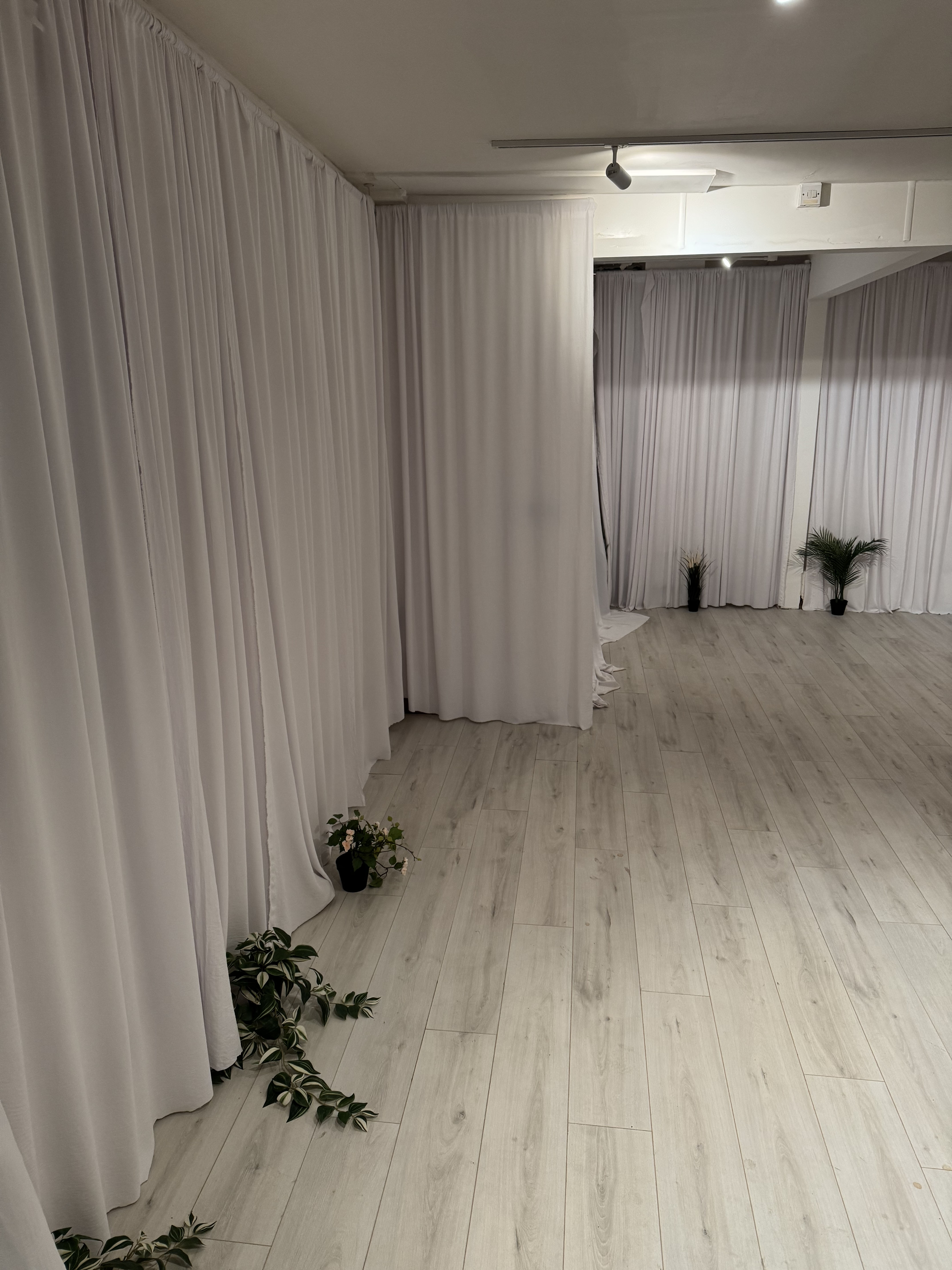 Studio in Beyond Stretch event space with pipe and drape for custom corporate or private events.