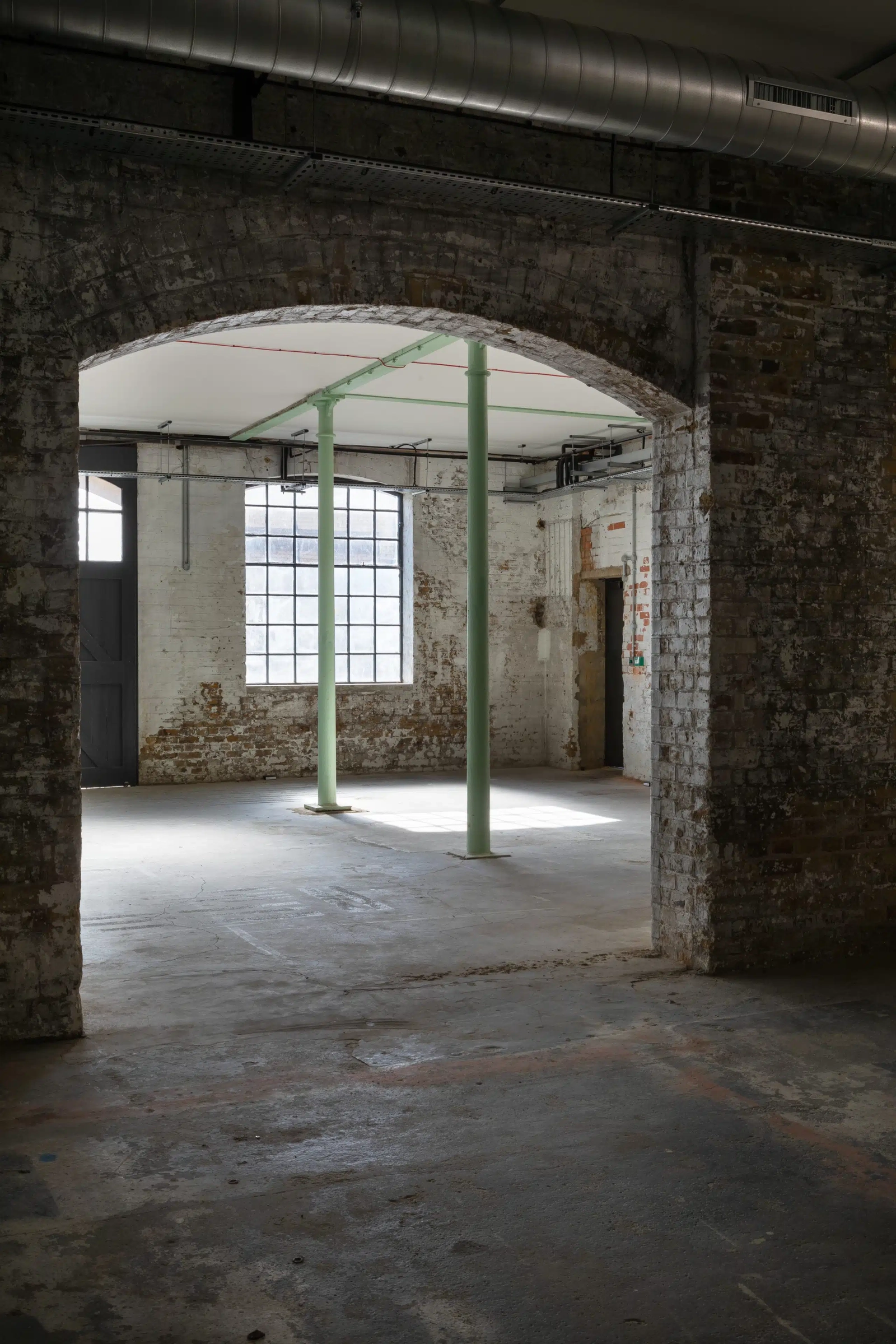 Industrial-chic event space with natural light for pop-ups and brand activations.
