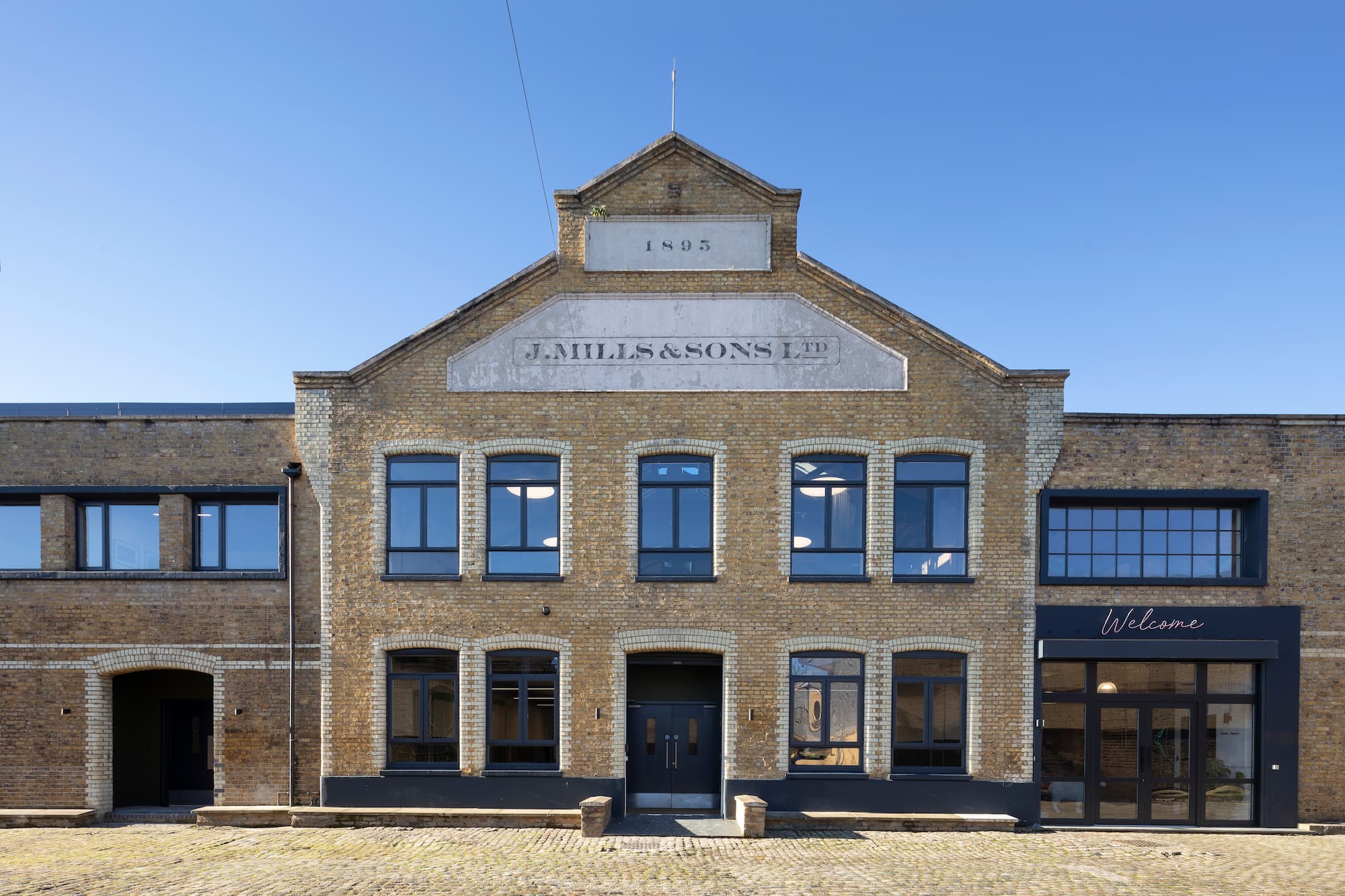 Industrial-chic event venue with brick facade for creative summits and offsites.