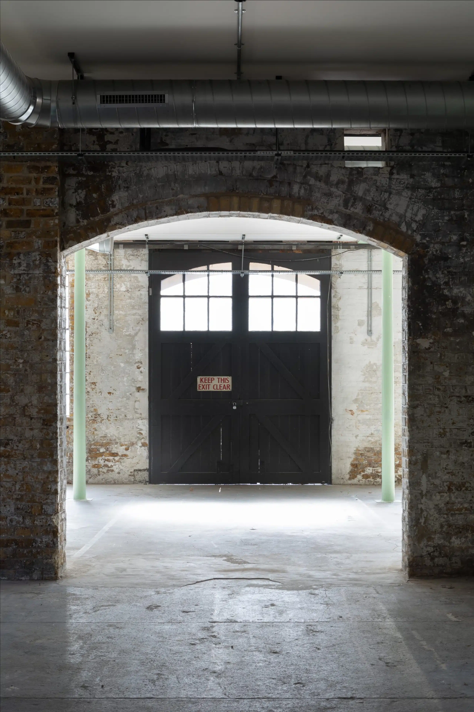 Industrial exhibition venue with raw character for corporate events and brand activations.