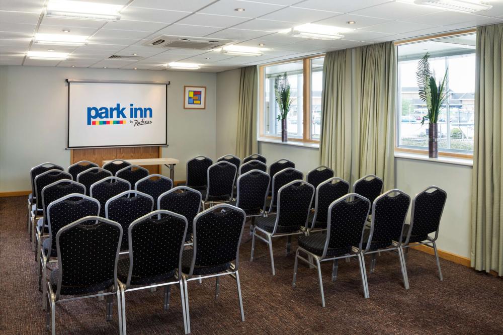 Theater-style meeting room at Park Inn Peterborough, ideal for corporate training and presentations.