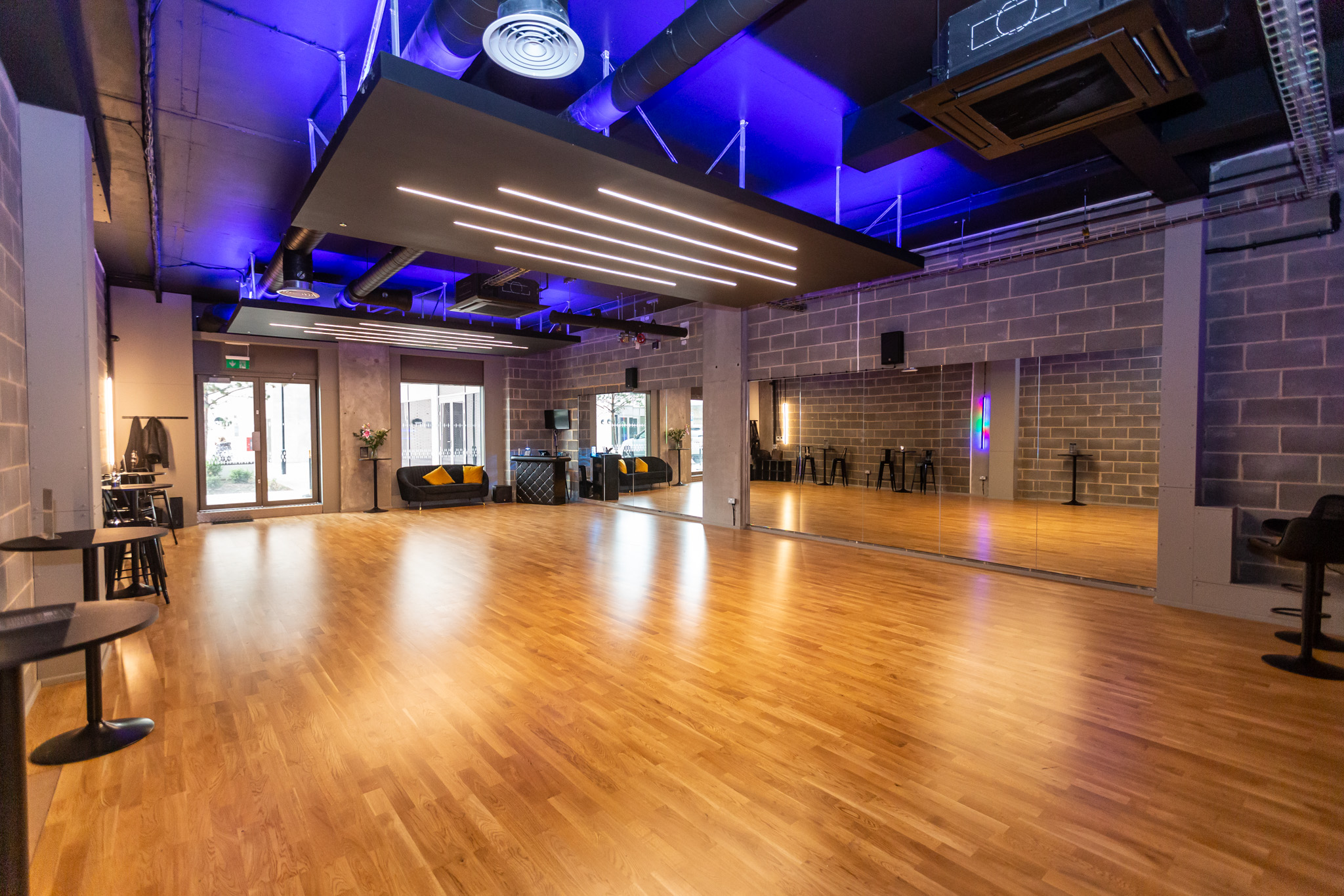 Industrial-chic dance studio with sprung flooring for creative workshops and fitness events.