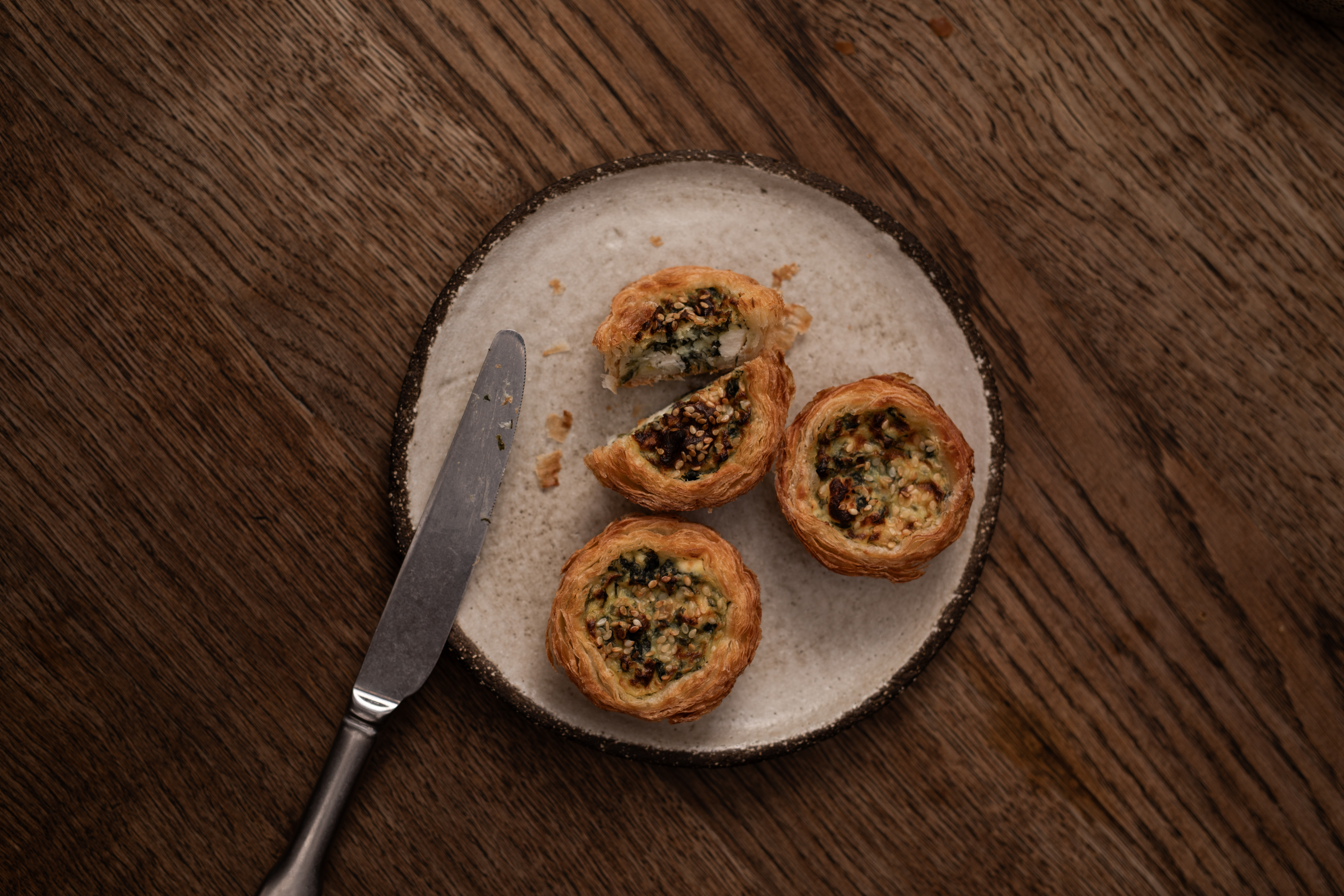 Rustic pastries on wood table at Pyro Restaurant, ideal for events and networking.