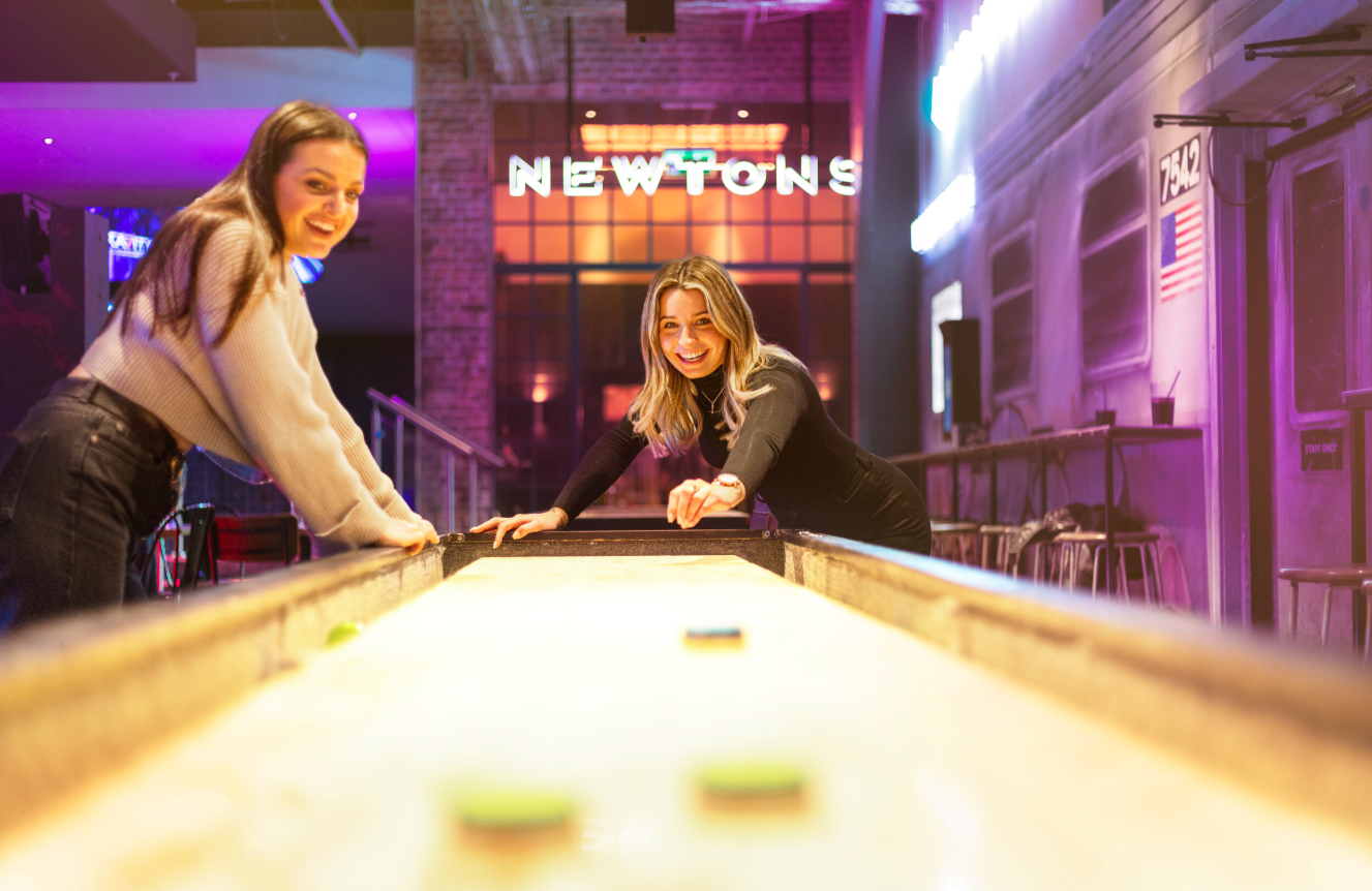 Gravity Wandsworth event space with shuffleboard, ideal for networking and social gatherings.