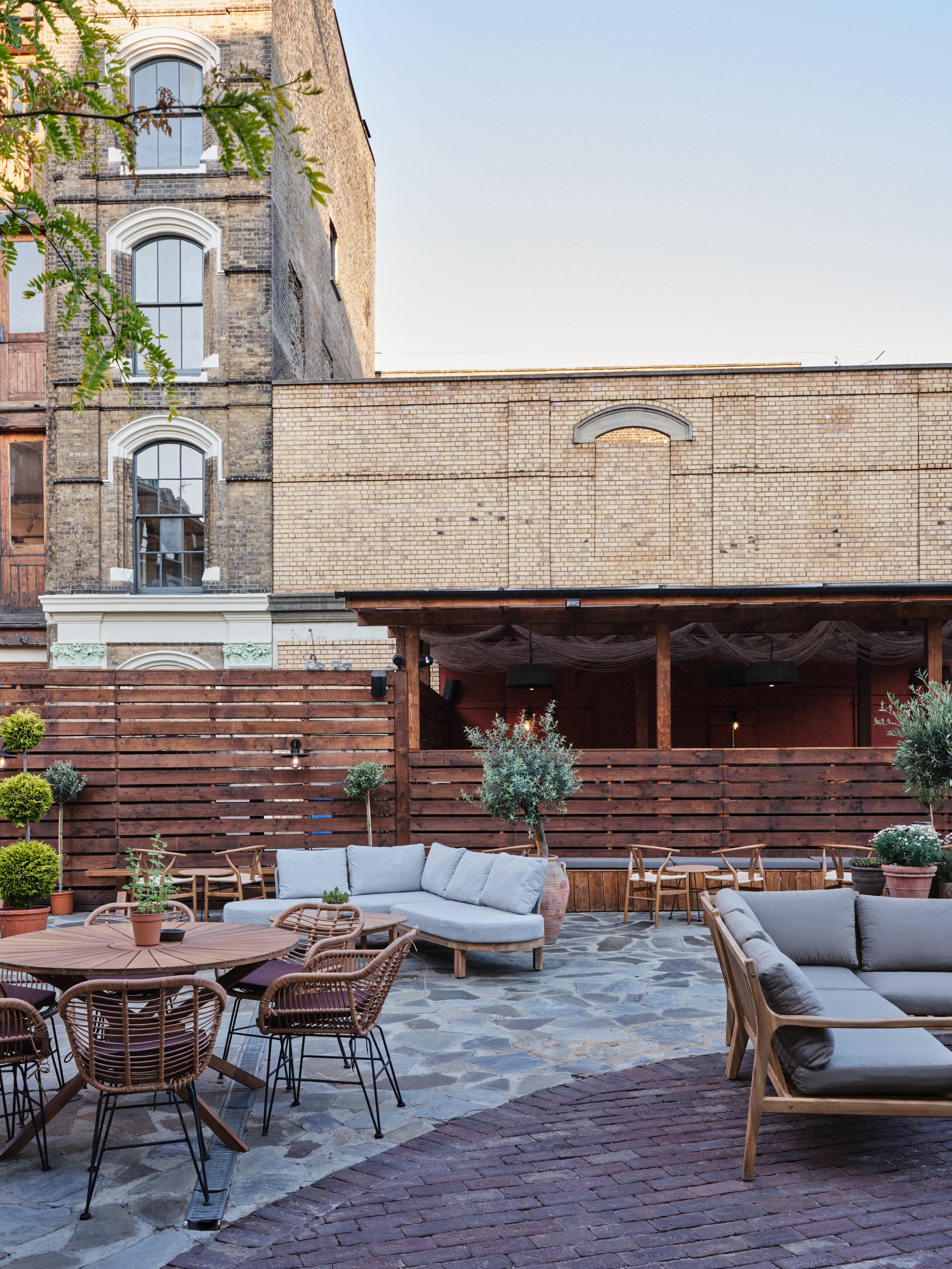 Cozy outdoor event space with rustic seating for social gatherings in Pyro.