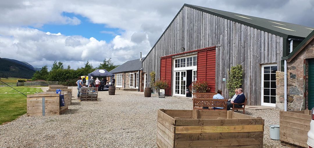 Rustic outdoor event venue at Hall in Rottal Estate for corporate networking or social reception.