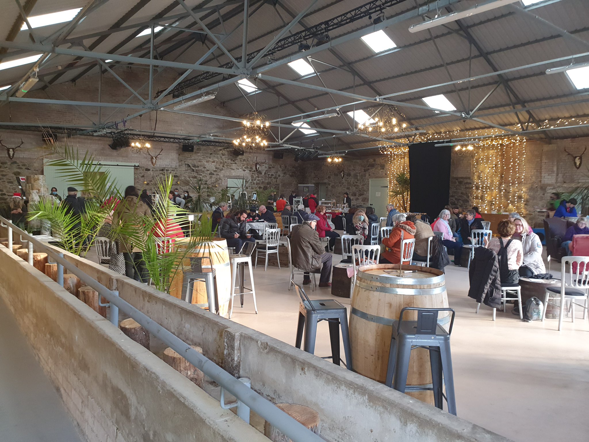 Rustic industrial networking venue at Hall in Rottal Estate with barrel tables for events.