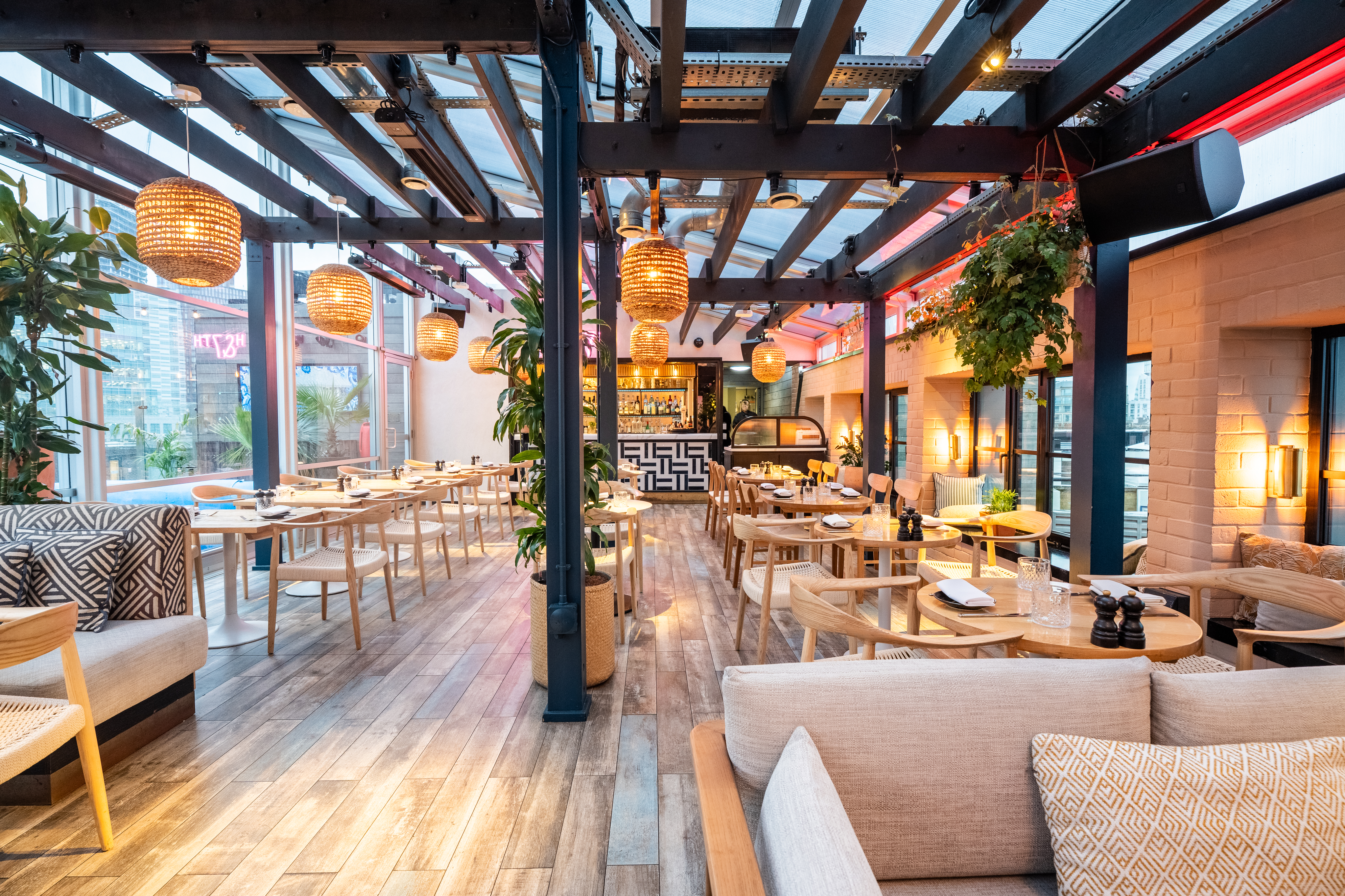 Modern restaurant in London, featuring warm wood tones for networking events.