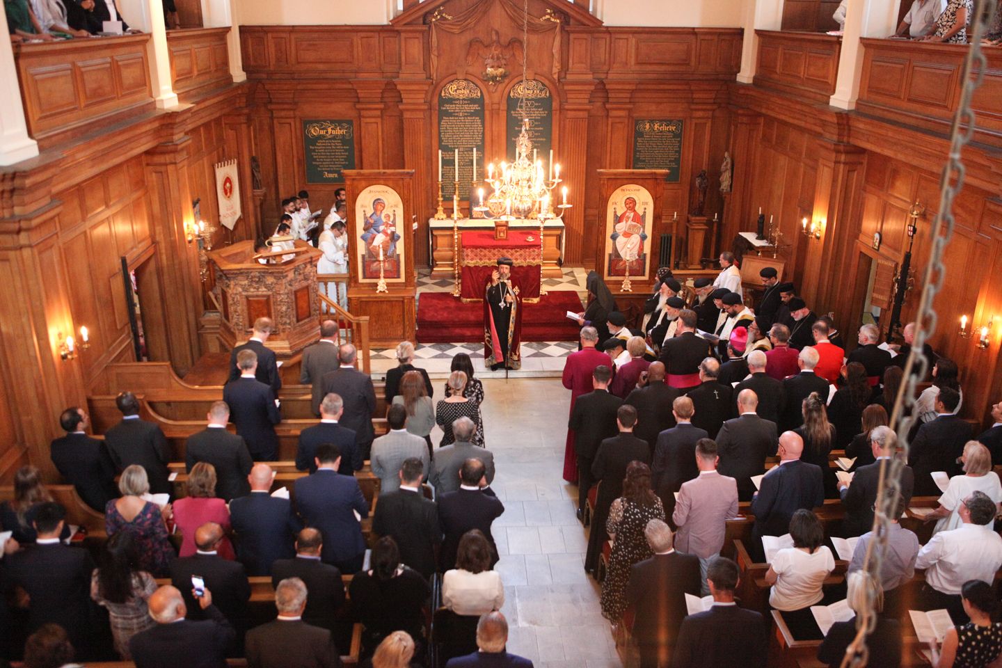 Heart in The Sanctuary & Soul: Formal event in ornate wood-paneled historic venue.
