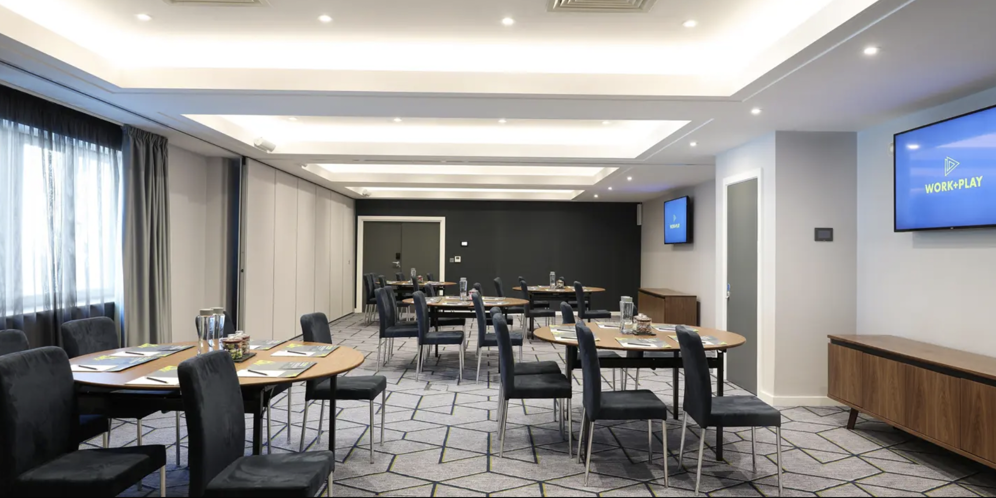 Modern cabaret-style conference room for workshops and breakout sessions at Malmaison Brighton.