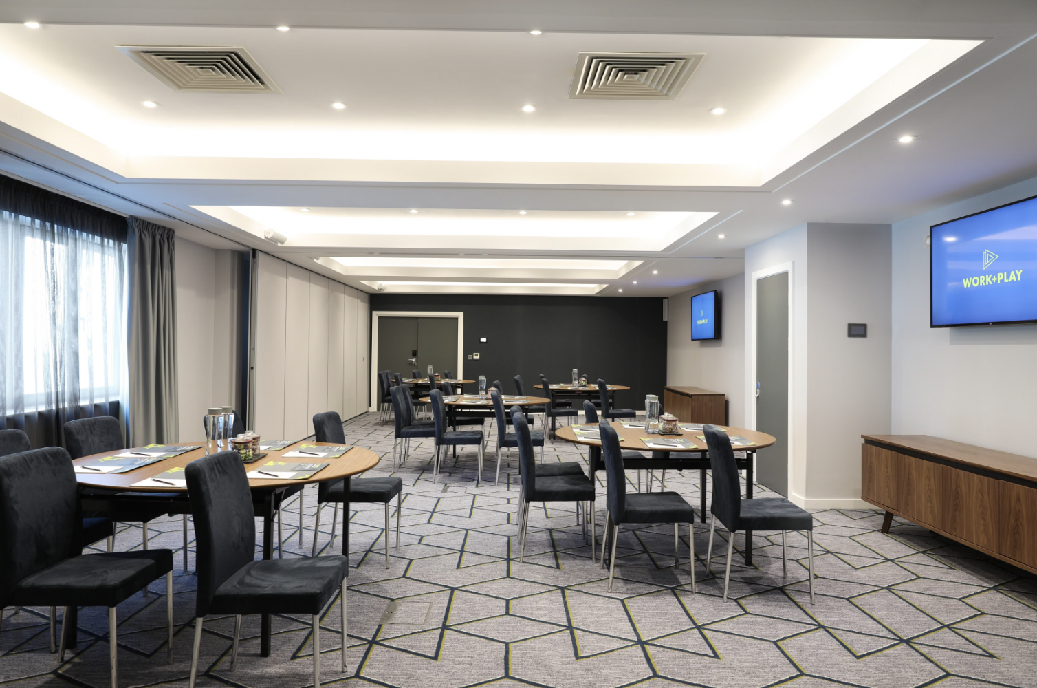 Modern cabaret-style breakout room at Malmaison Brighton for workshops and corporate meetings.