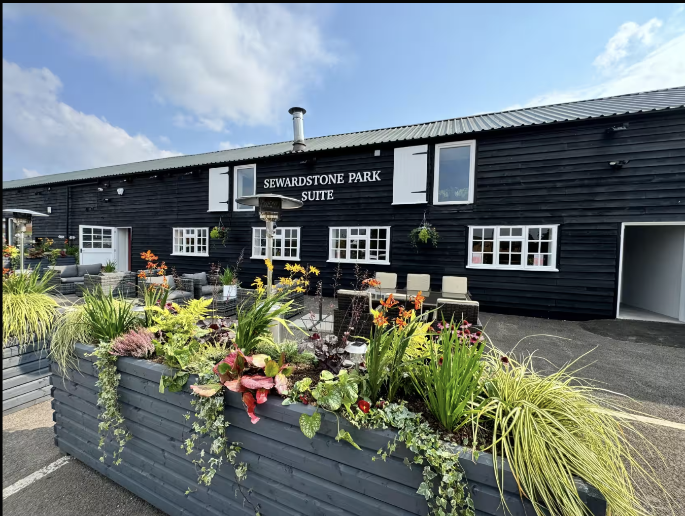 Rustic Sewardstone Park Suite event space with outdoor terrace for corporate retreats and meetings.
