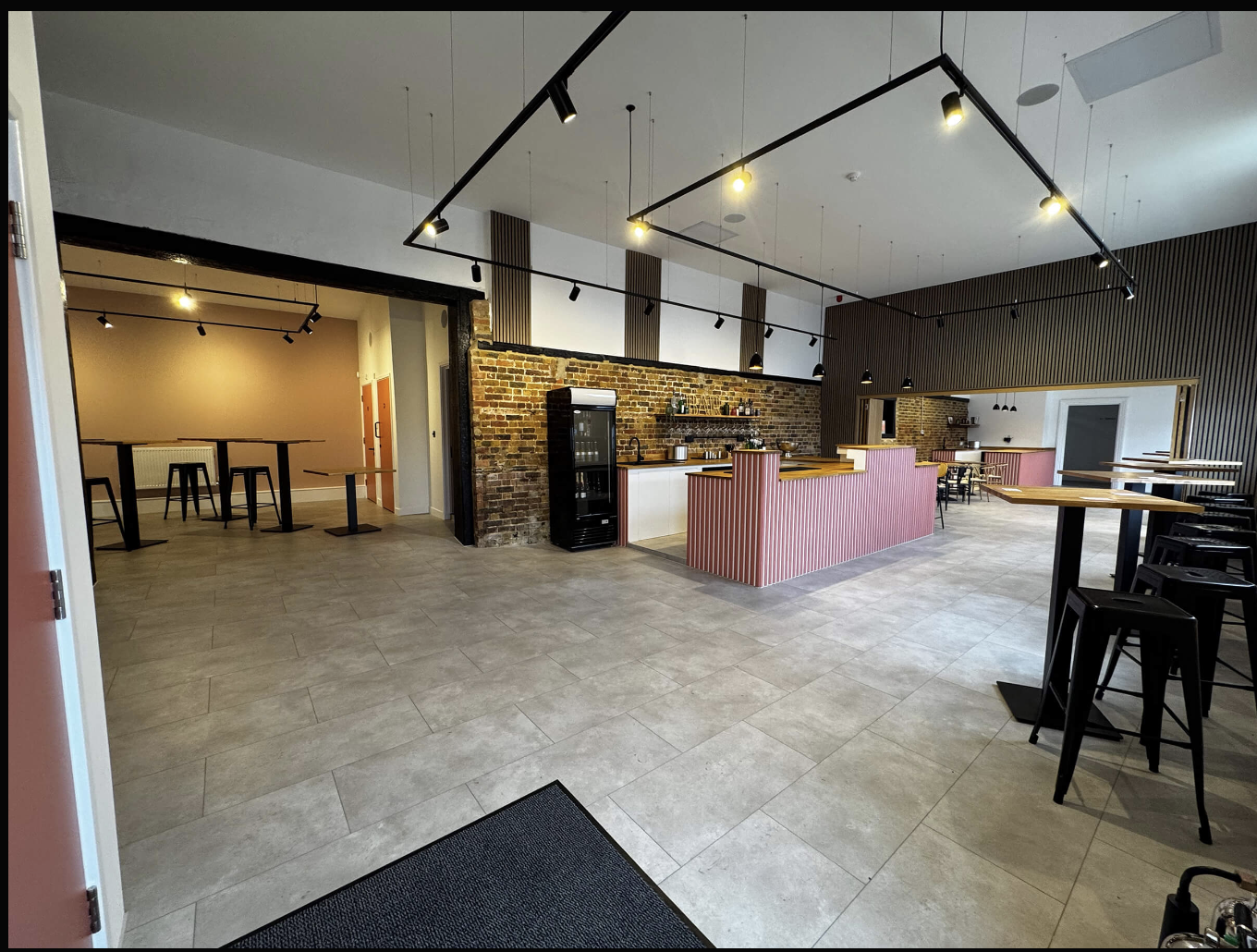 Sewardstone Park Suite industrial event space with bar for networking and team gatherings.