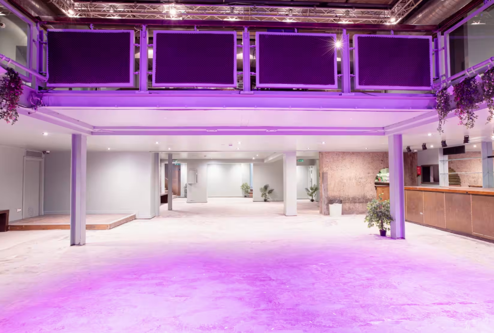 Acres23 industrial-chic event venue with bar for corporate receptions and creative activations.