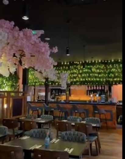 Floral-themed bar at Kerala Canteen for networking receptions and product launches.