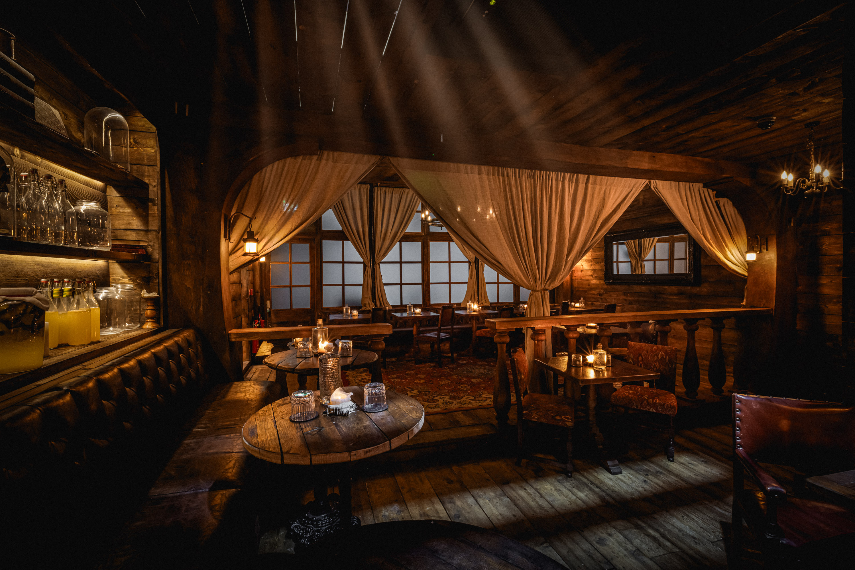 Captain’s Quarters VIP dinner at Rhum Tavern with warm wood decor for exclusive networking events.