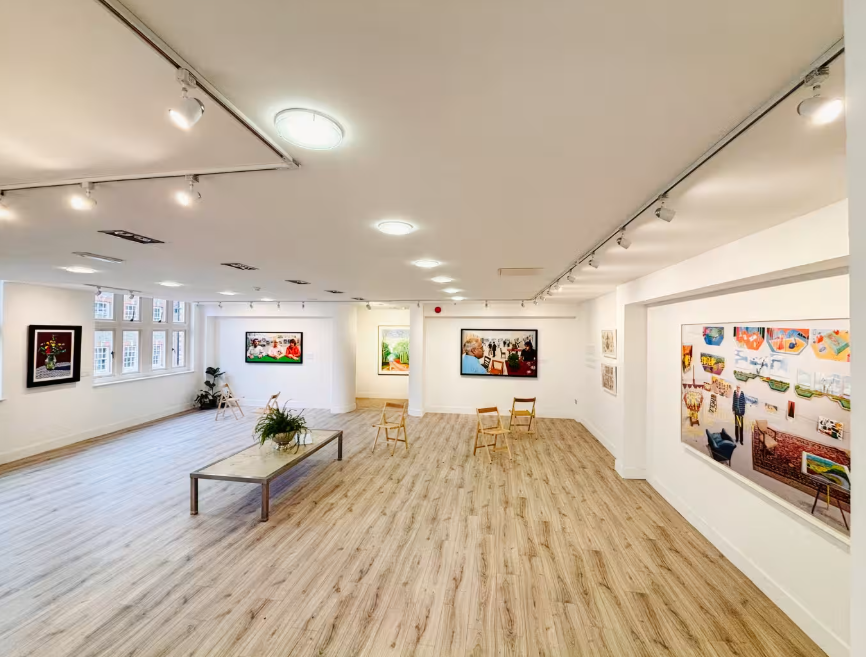 Modern gallery space with track lighting for networking receptions and product launches.