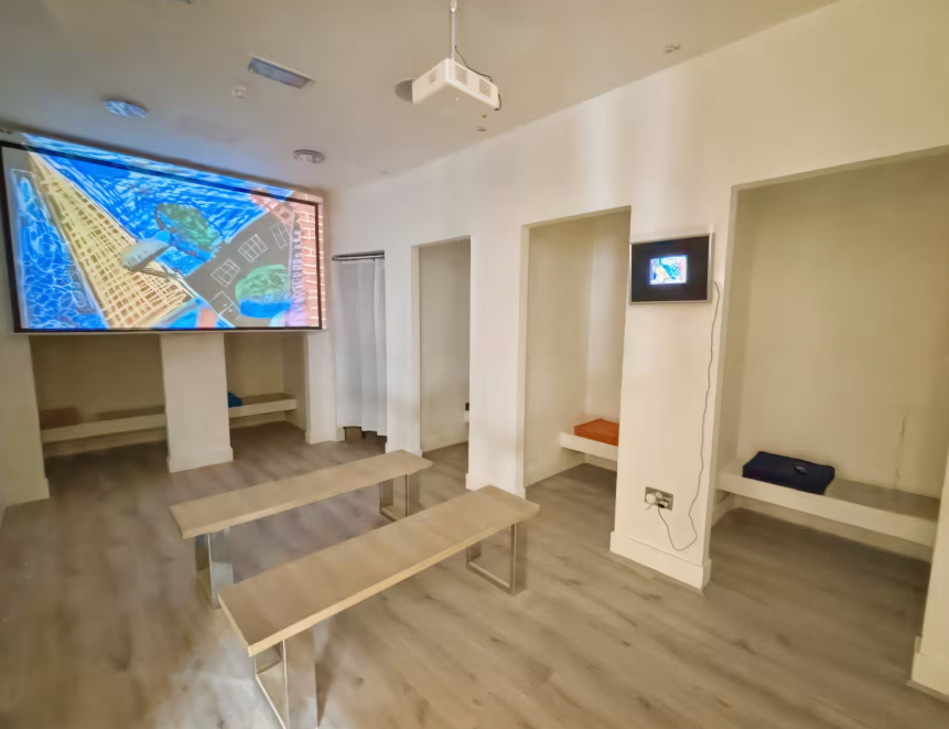Minimalist MODO Gallery breakout space with bench seating for corporate events and workshops.
