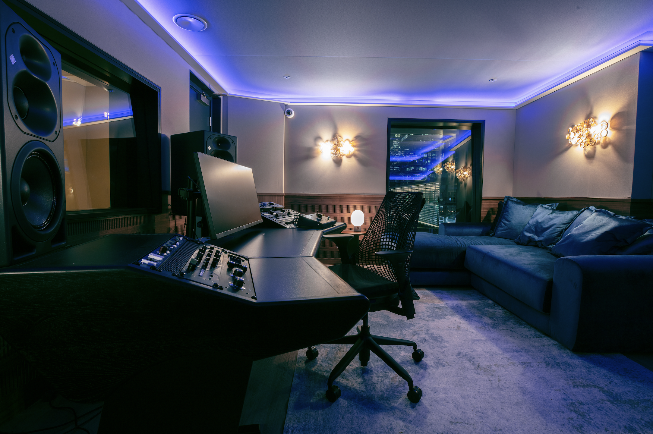 "Modern recording studio with ambient lighting for intimate events and creative meetings."